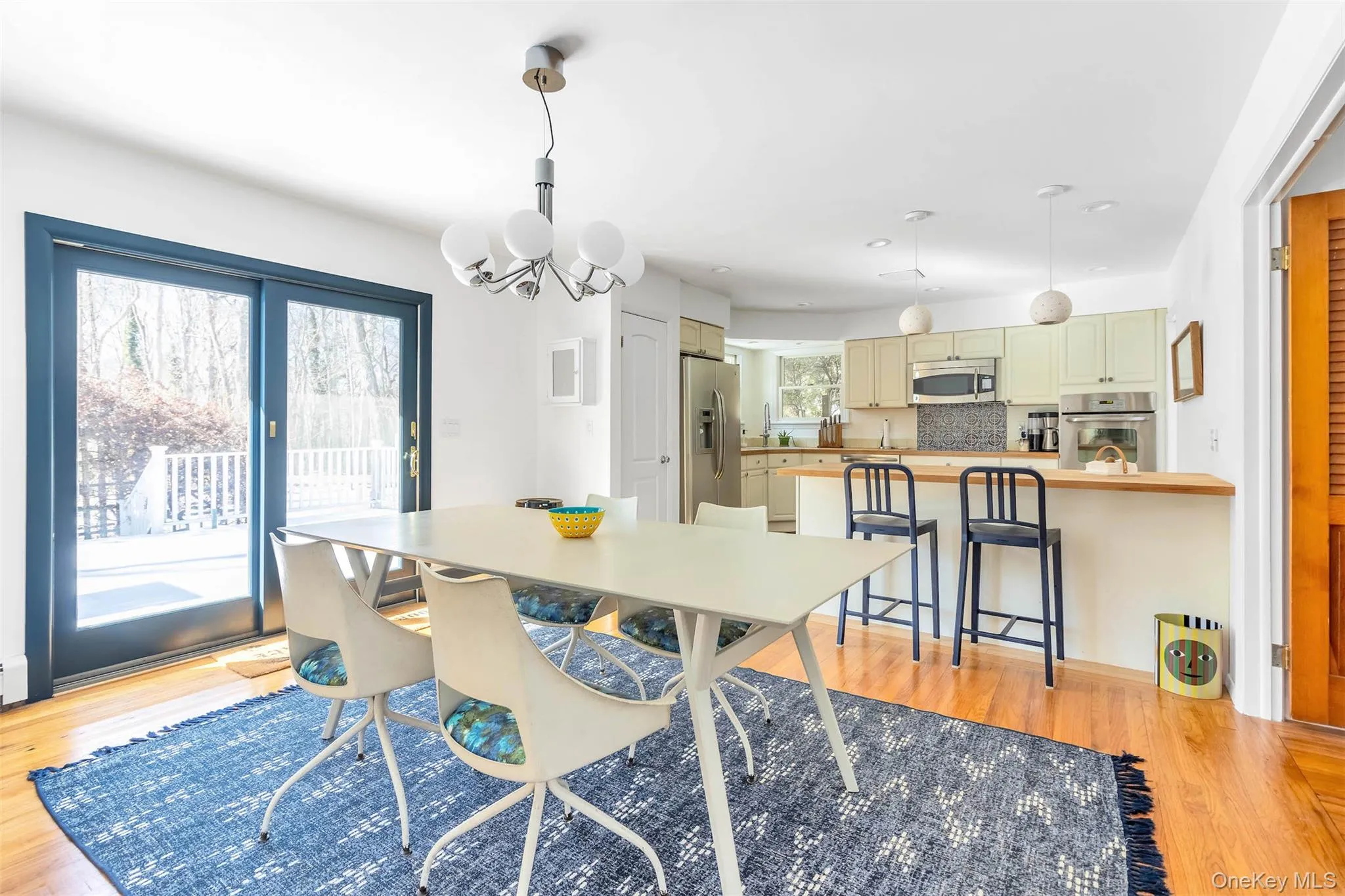 Dining area featuring light hardwood / wood-style flooring and a chandelier Dining area featuring light hardwood / wood-style flooring and a chandelier
