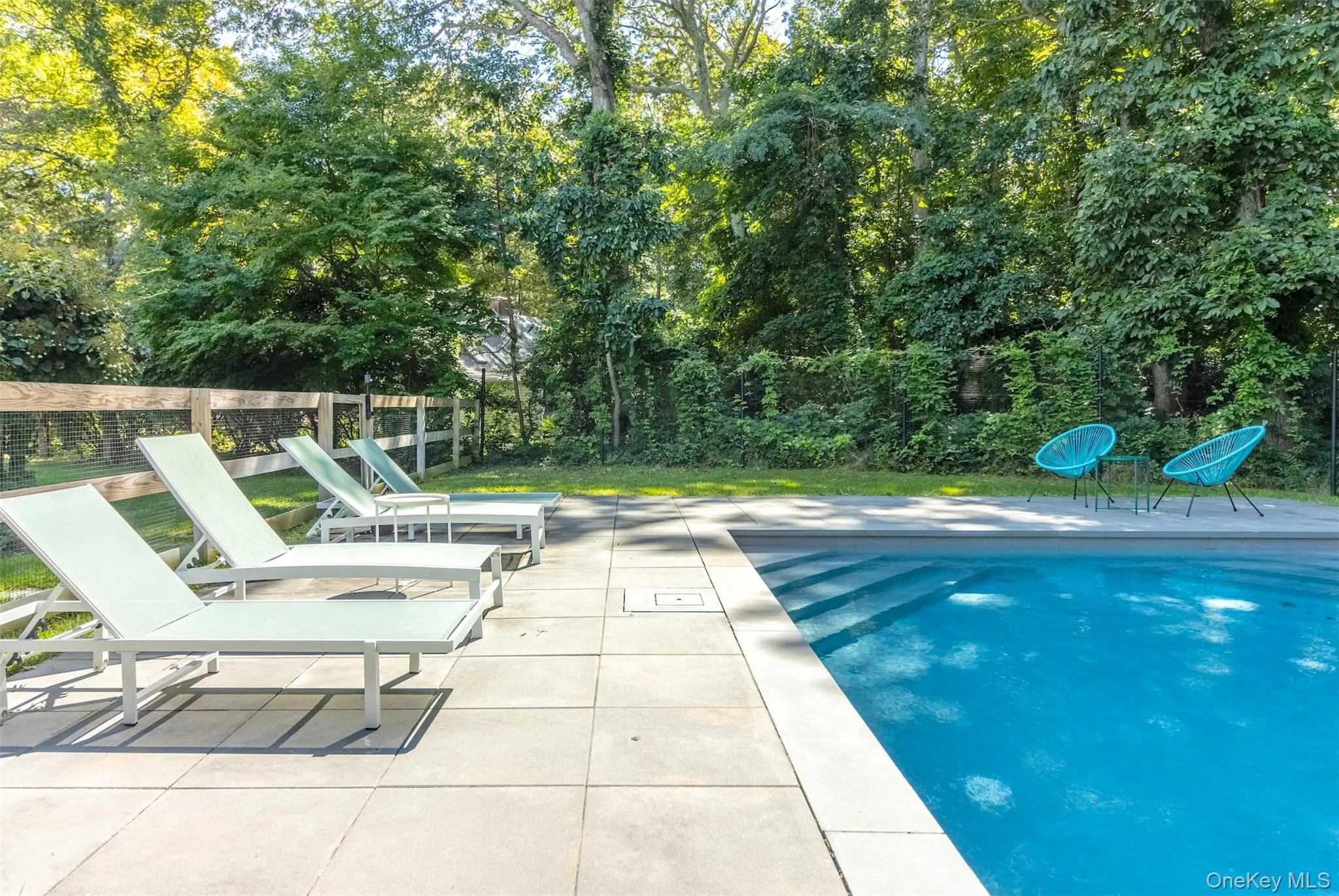View of pool with a patio area View of pool with a patio area