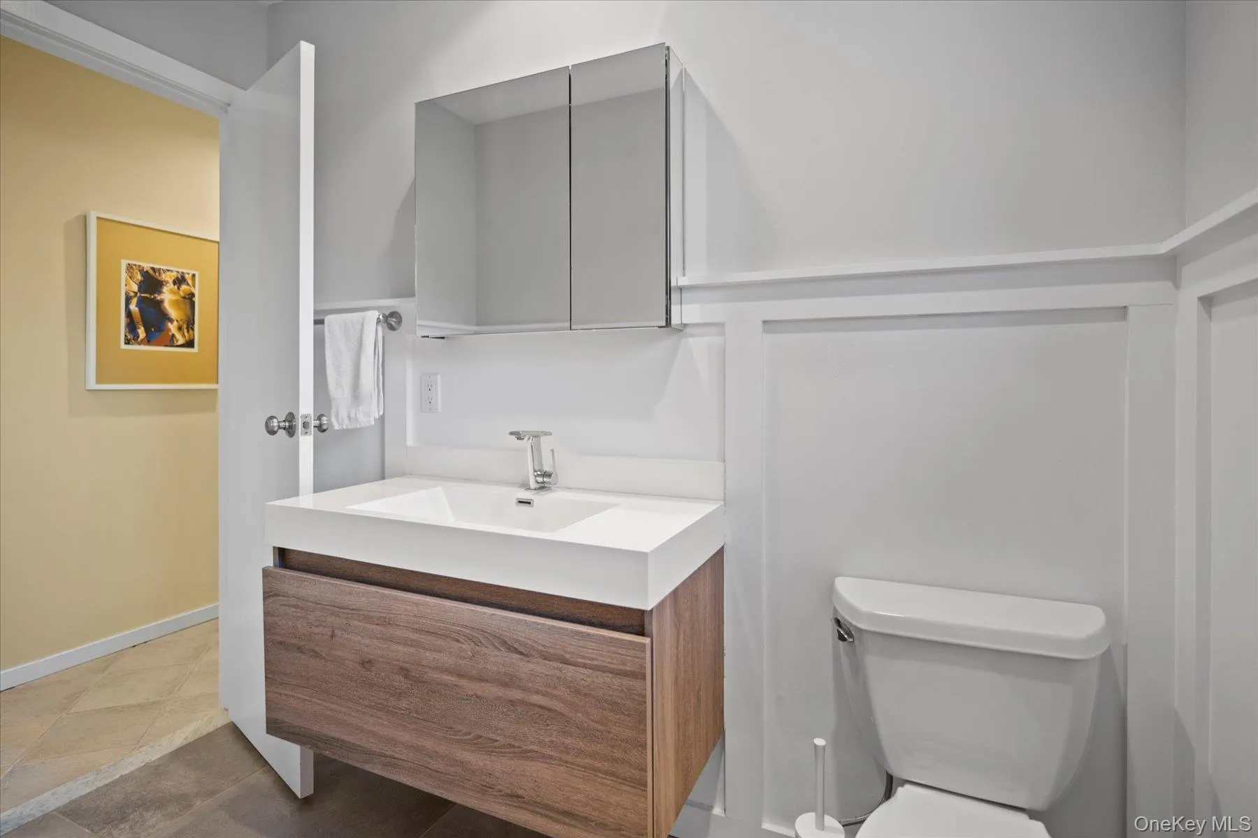 Bathroom #3 in bedroom hall with tile patterned floors, toilet, and vanity Bathroom #3 in bedroom hall with tile patterned floors, toilet, and vanity