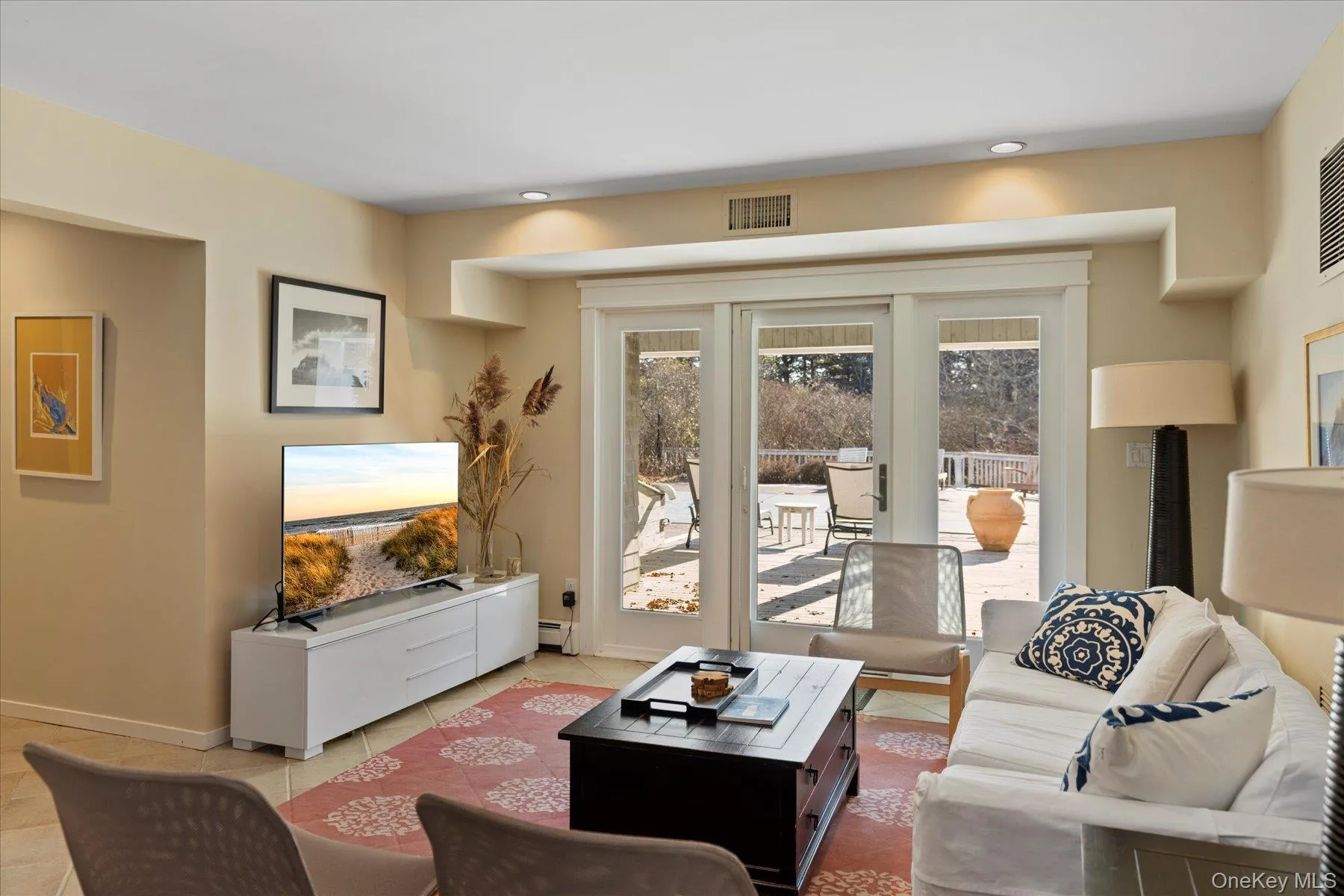 Lower level family room with doors to covered patio and pool Lower level family room with doors to covered patio and pool