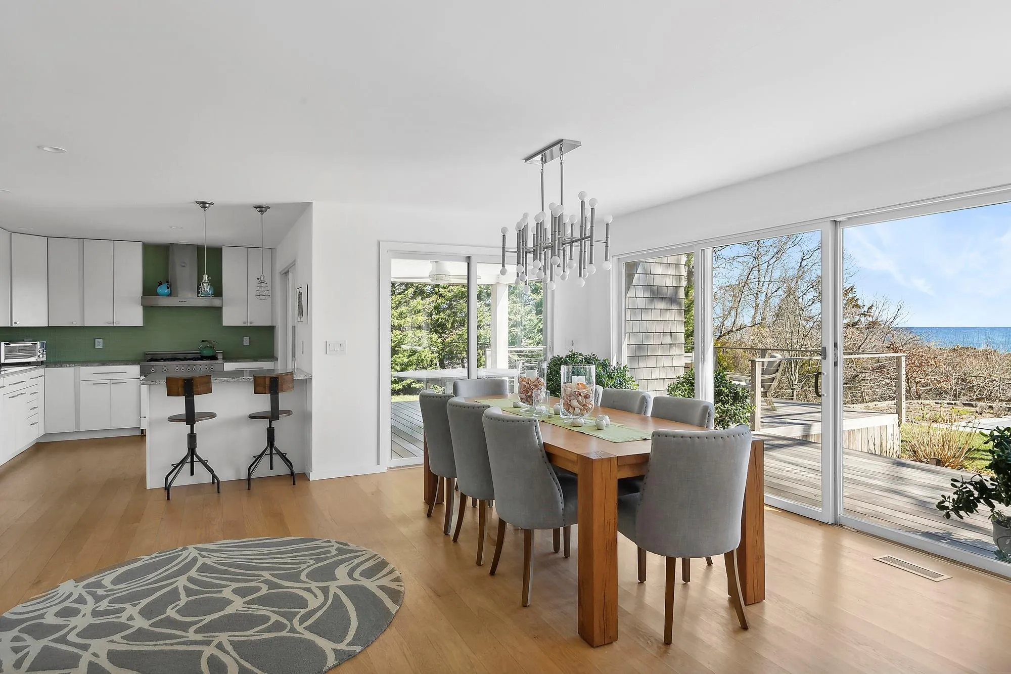 Dining space featuring light hardwood / wood-style flooring and an inviting chandelier Dining space featuring light hardwood / wood-style flooring and an inviting chandelier