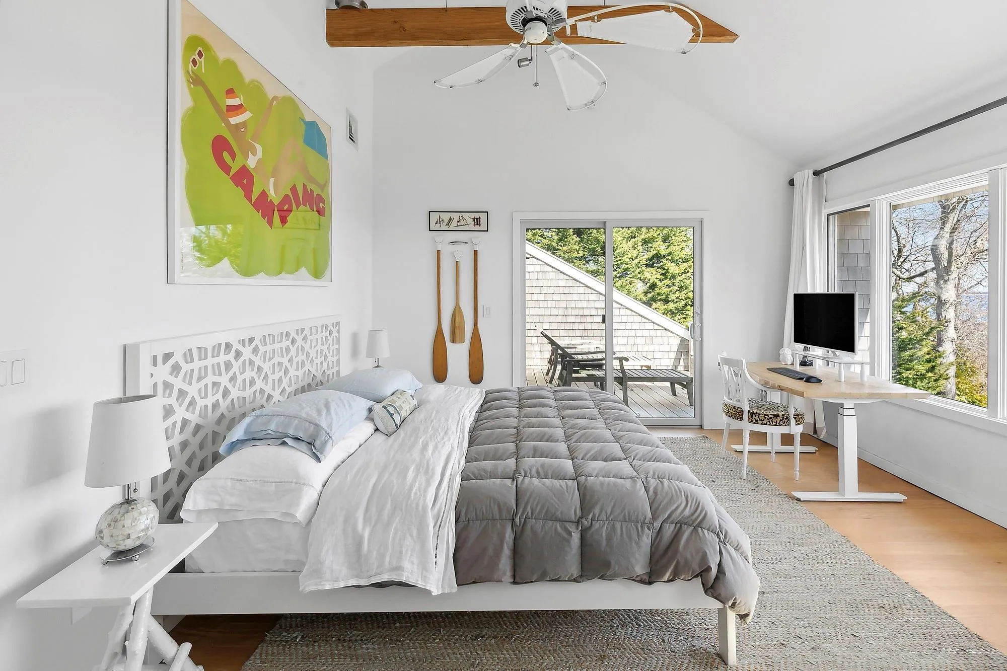 Bedroom with hardwood / wood-style flooring, ceiling fan, vaulted ceiling, and access to exterior Bedroom with hardwood / wood-style flooring, ceiling fan, vaulted ceiling, and access to exterior