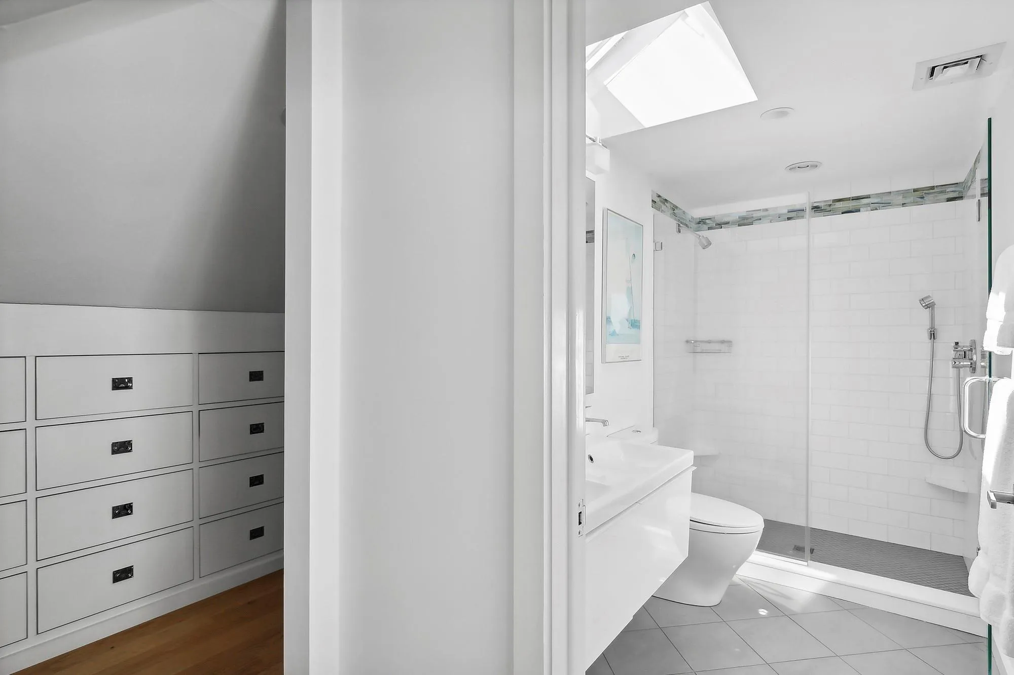 Bathroom featuring an enclosed shower, tile patterned flooring, toilet, vaulted ceiling, and vanity Bathroom featuring an enclosed shower, tile patterned flooring, toilet, vaulted ceiling, and vanity