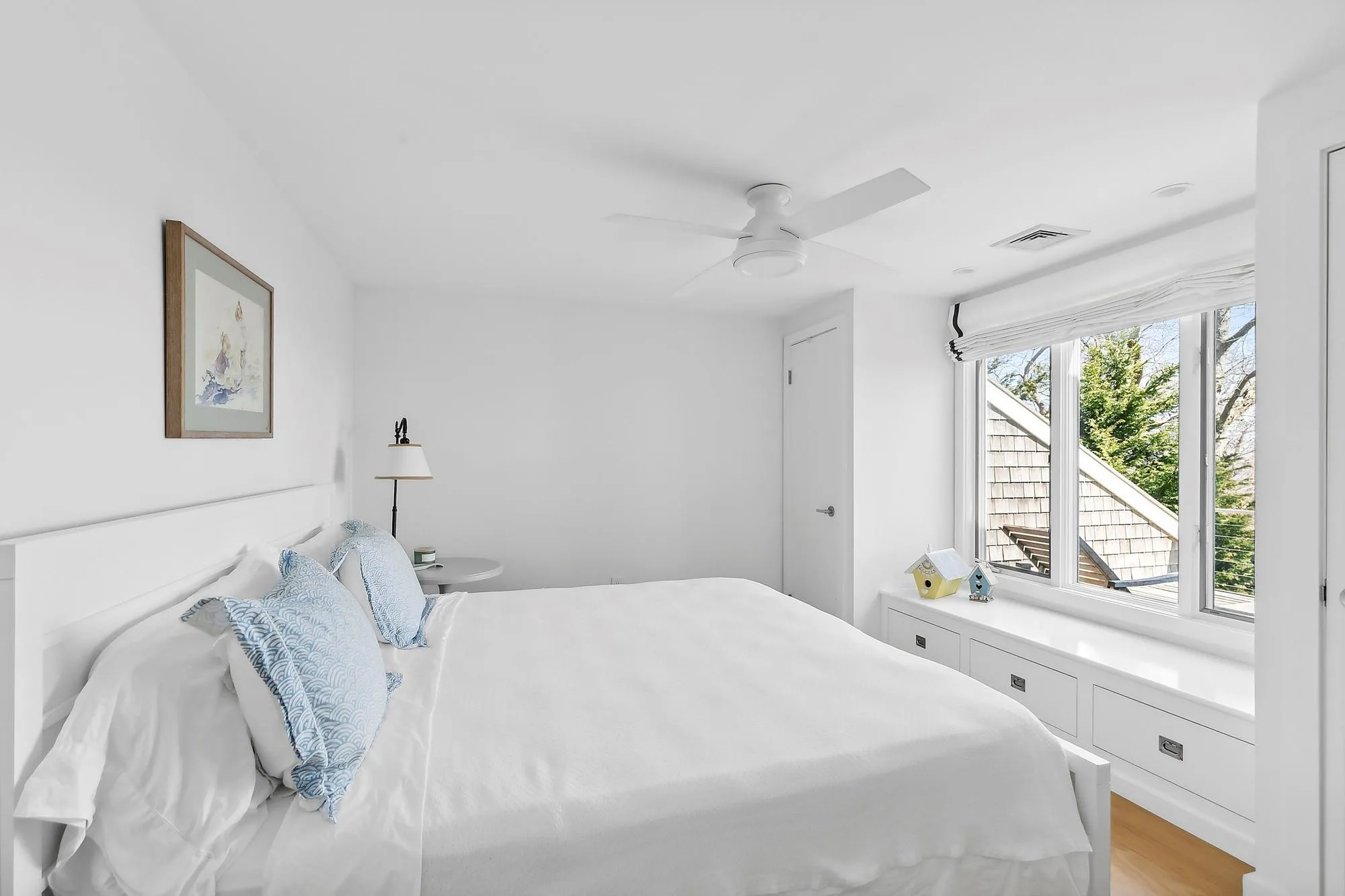 Bedroom with light hardwood / wood-style floors and ceiling fan Bedroom with light hardwood / wood-style floors and ceiling fan