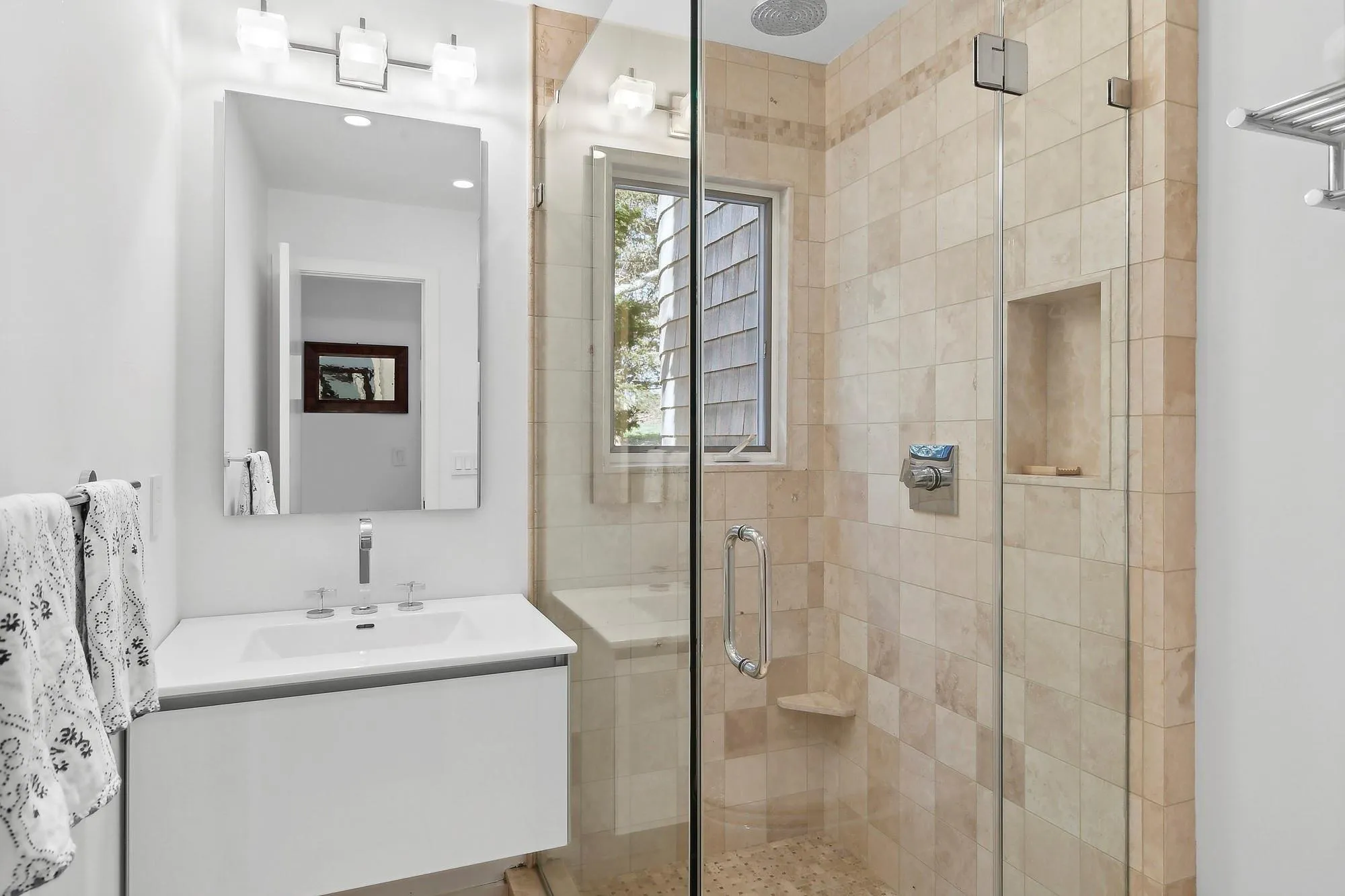 Bathroom with vanity and a shower with door Bathroom with vanity and a shower with door