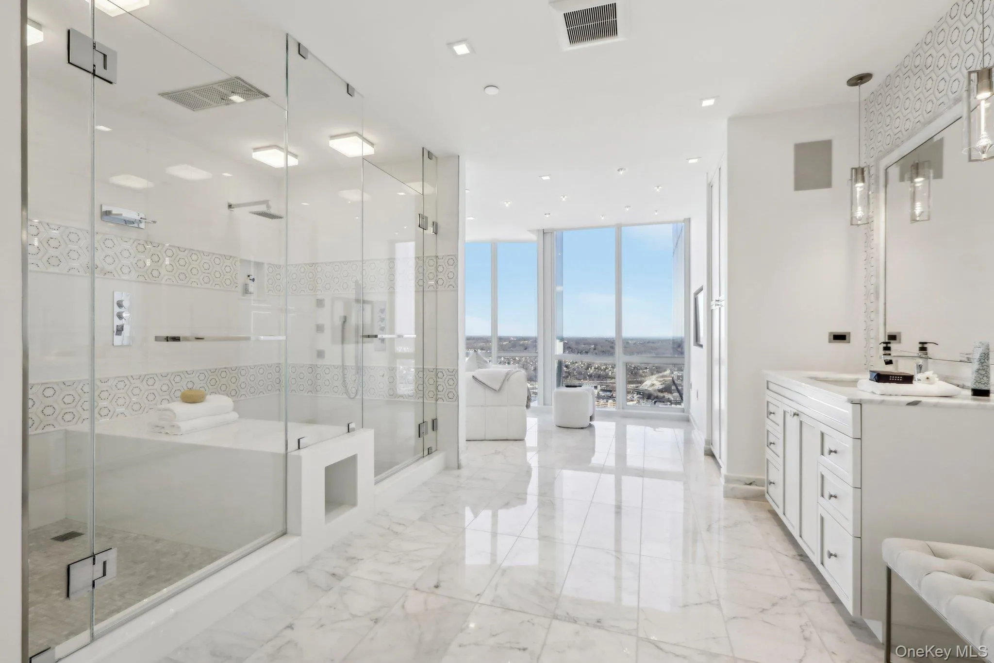Primary Bath North with three vanities and double shower Primary Bath North with three vanities and double shower
