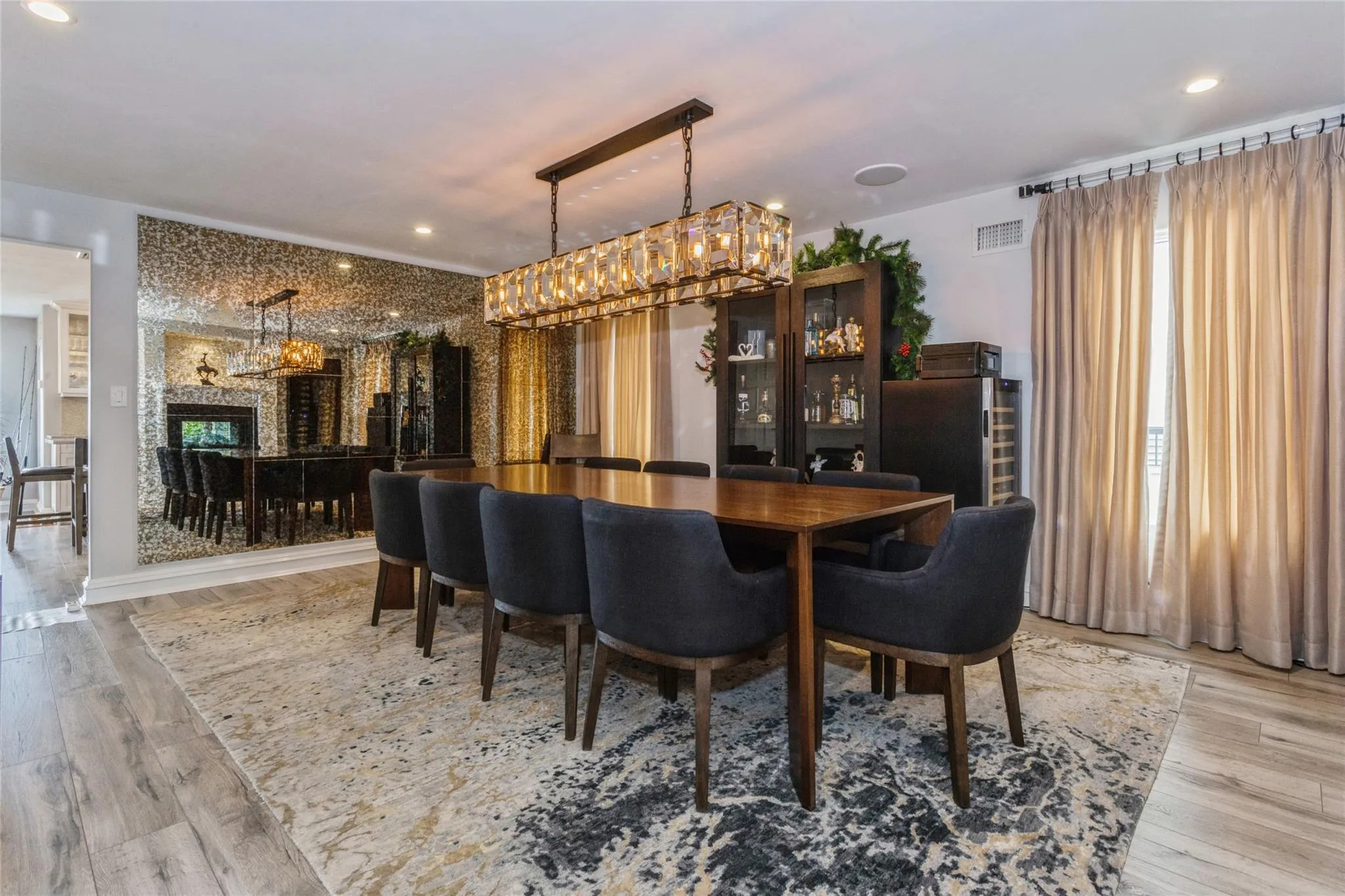 Dining room with a fireplace and light hardwood / wood-style floors Dining room with a fireplace and light hardwood / wood-style floors