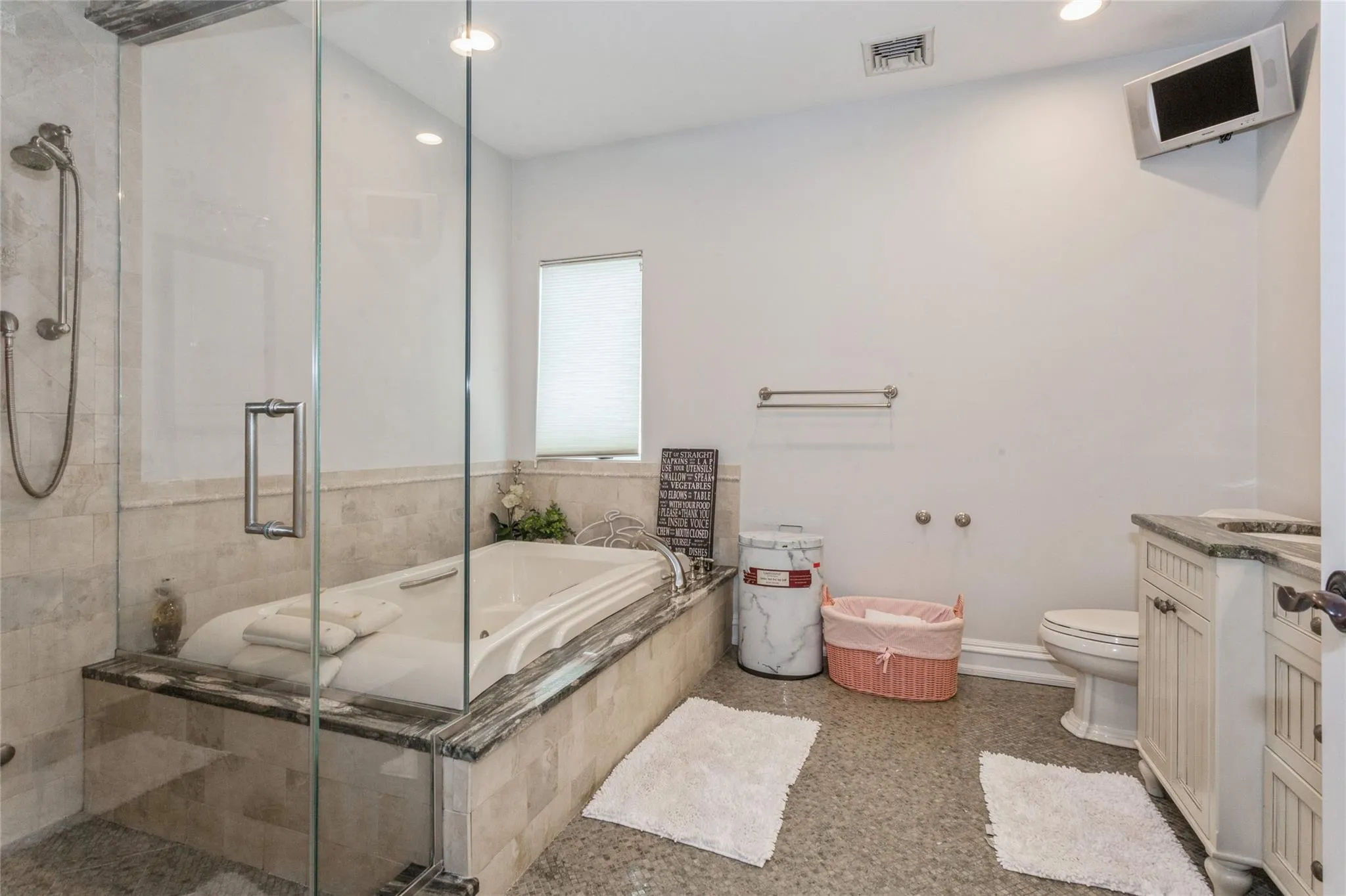 Full bathroom featuring toilet, vanity, and plus walk in shower Full bathroom featuring toilet, vanity, and plus walk in shower