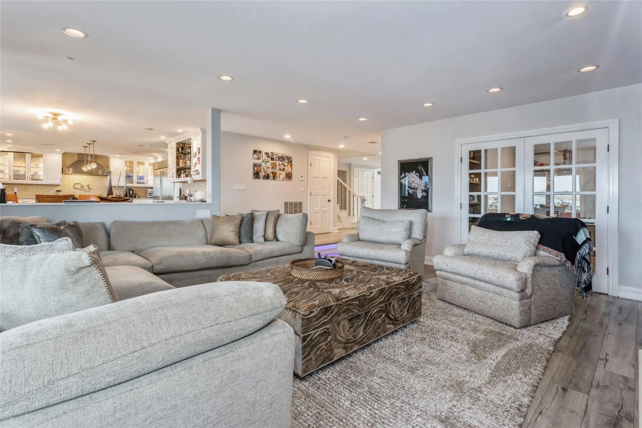 Living room featuring french doors and hardwood / wood-style floors Living room featuring french doors and hardwood / wood-style floors