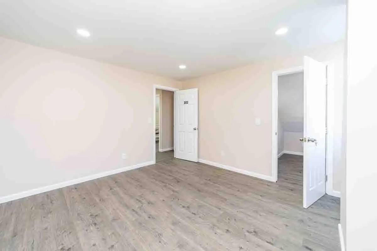 Spare room with recessed lighting, light wood-style flooring, and baseboards Spare room with recessed lighting, light wood-style flooring, and baseboards
