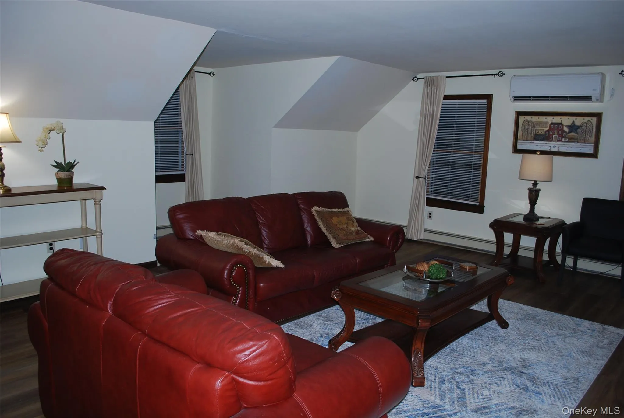 Living area with dark wood-type flooring. Living area with dark wood-type flooring.