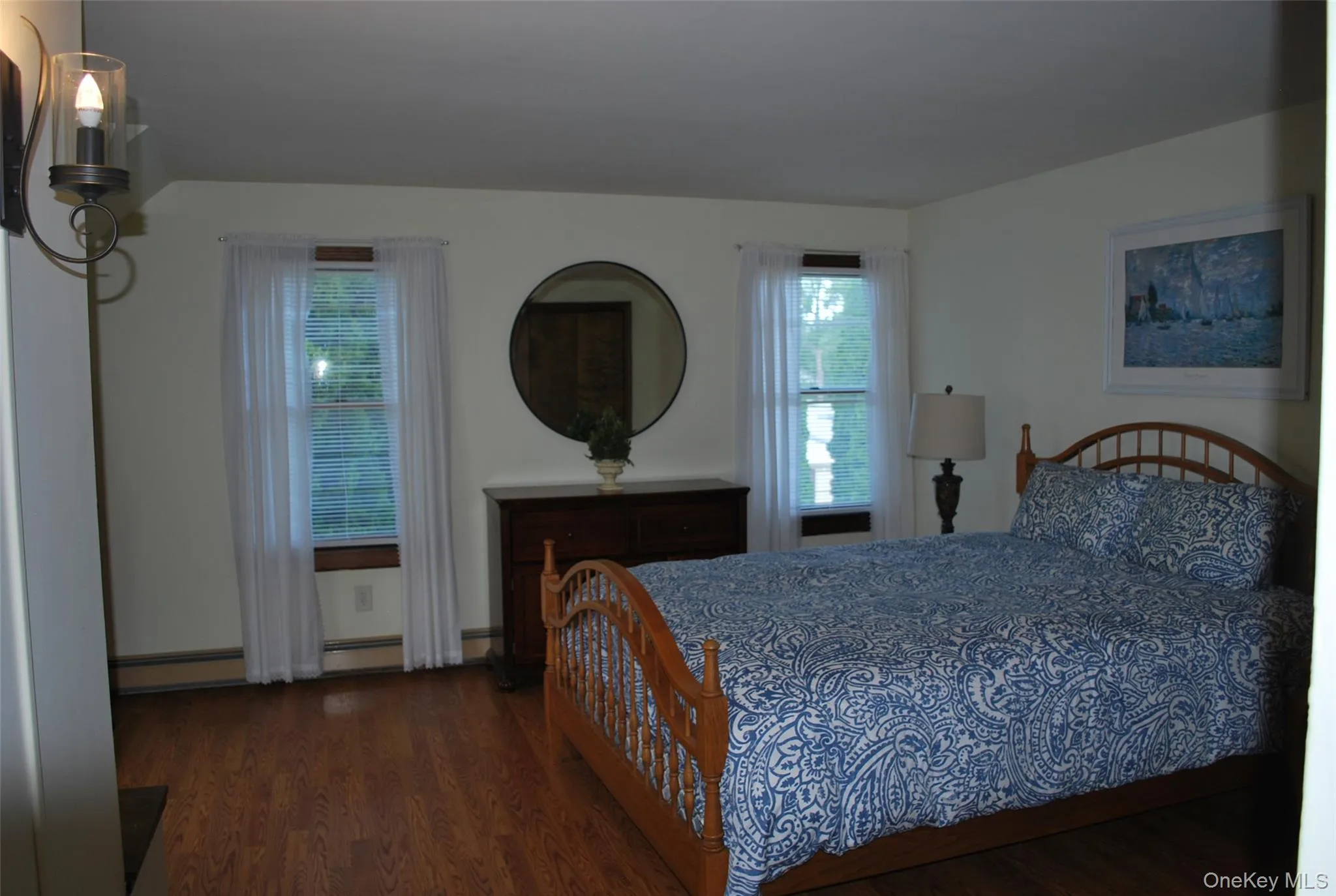 Bedroom with dark wood-type flooring. Bedroom with dark wood-type flooring.