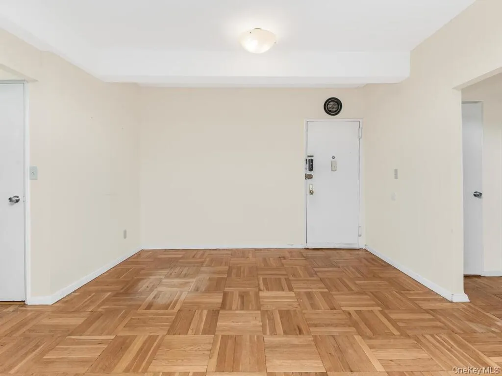 Unfurnished room featuring beam ceiling and baseboards Unfurnished room featuring beam ceiling and baseboards