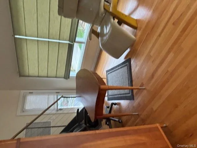 Home office featuring light wood-type flooring and healthy amount of natural light Home office featuring light wood-type flooring and healthy amount of natural light