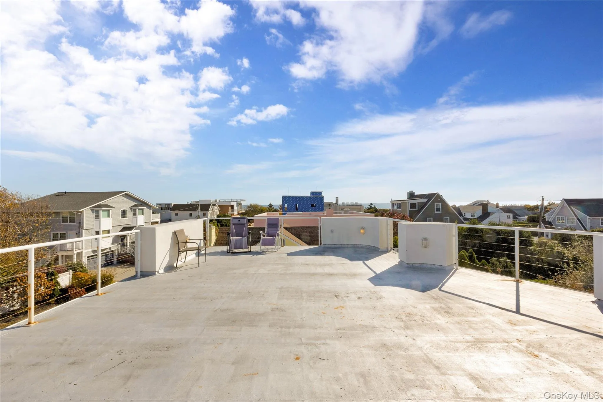 View of patio with a gate and a residential view View of patio with a gate and a residential view