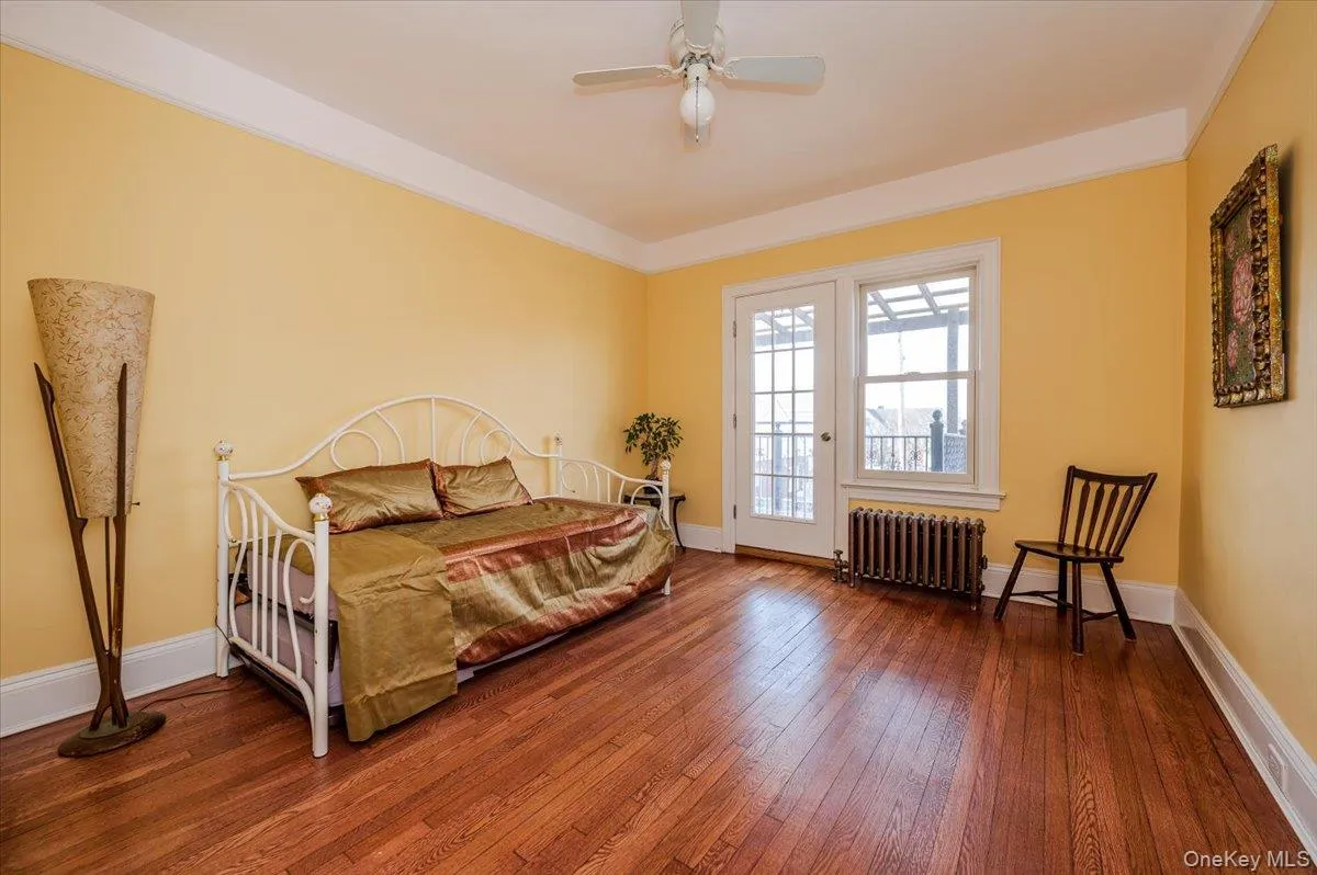 2nd Floor, Rear Bedroom featuring a ceiling fan, terrace access 2nd Floor, Rear Bedroom featuring a ceiling fan, terrace access
