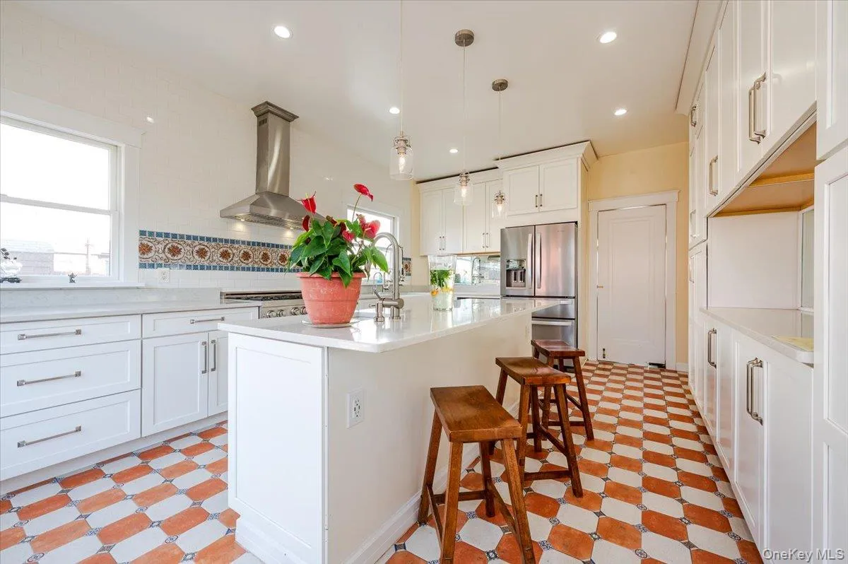 Large Kitchen featuring professional style gas range kitchen island with prep sink, and stainless steel refrigerator with ice & water dispenser Large Kitchen featuring professional style gas range kitchen island with prep sink, and stainless steel refrigerator with ice & water dispenser