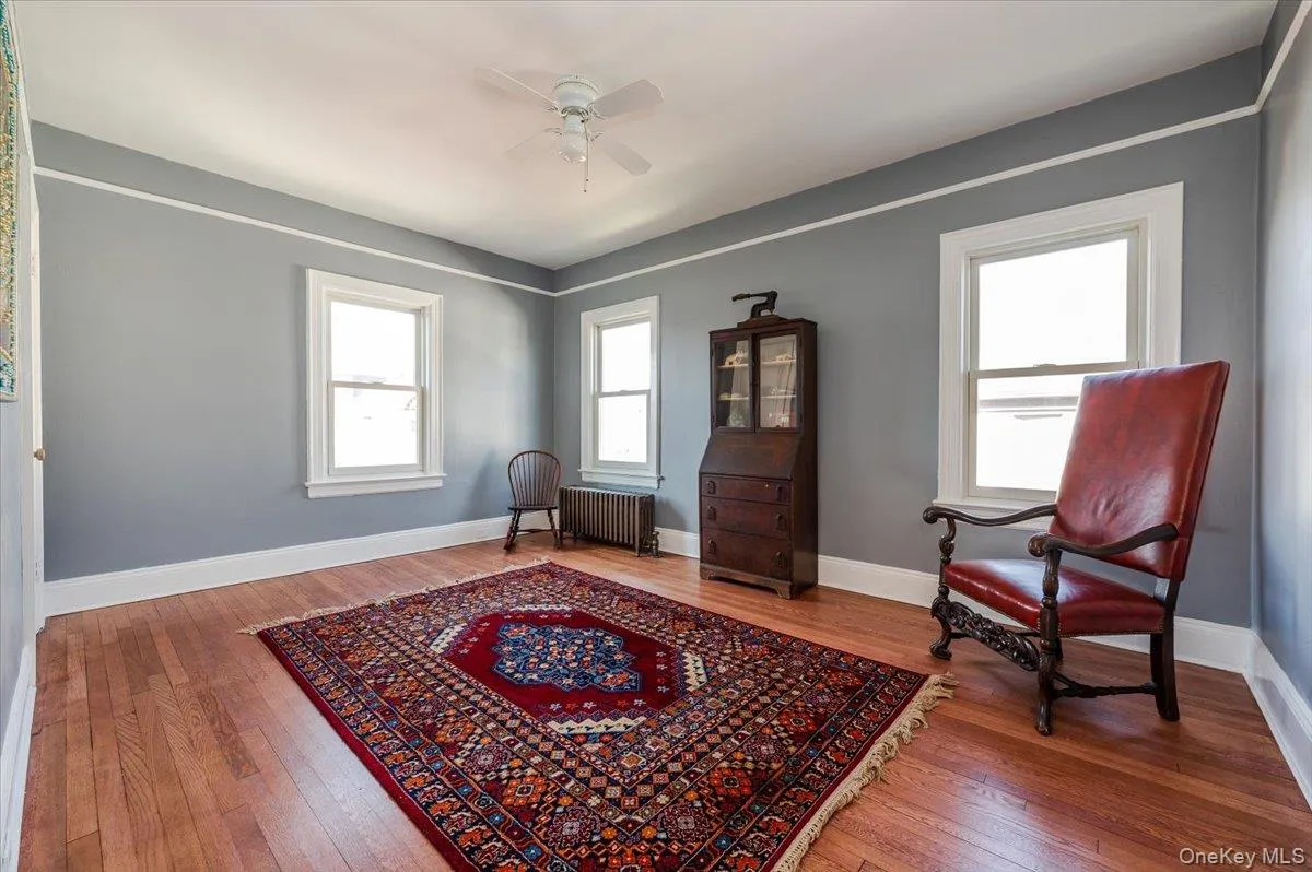 Large 2nd floor bedroom with a ceiling fan, and hardwood floors Large 2nd floor bedroom with a ceiling fan, and hardwood floors