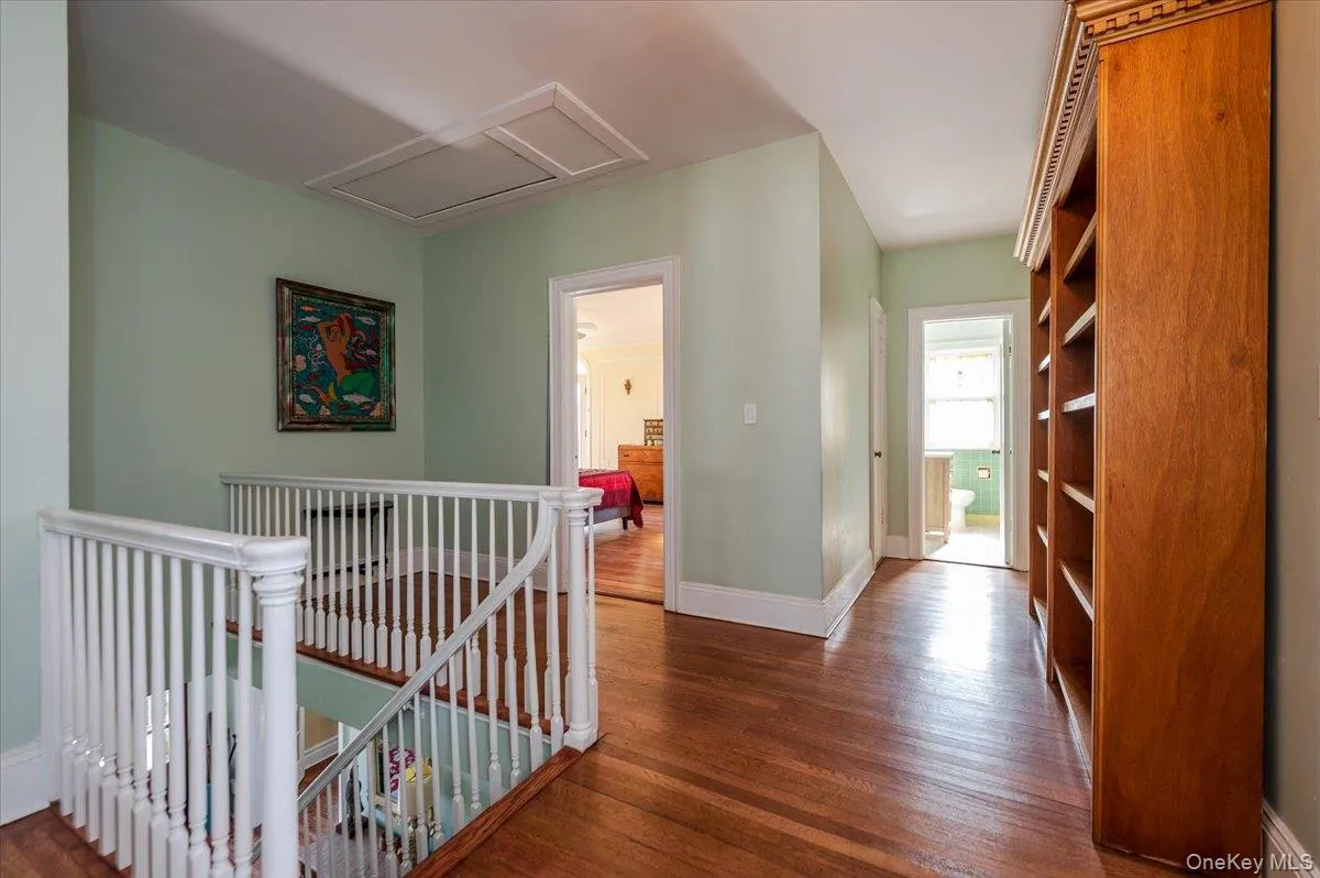 Large and gracious 2nd floor landing leading to 5 large bedrooms. Hardwood floors, bookshelves and attic access Large and gracious 2nd floor landing leading to 5 large bedrooms. Hardwood floors, bookshelves and attic access