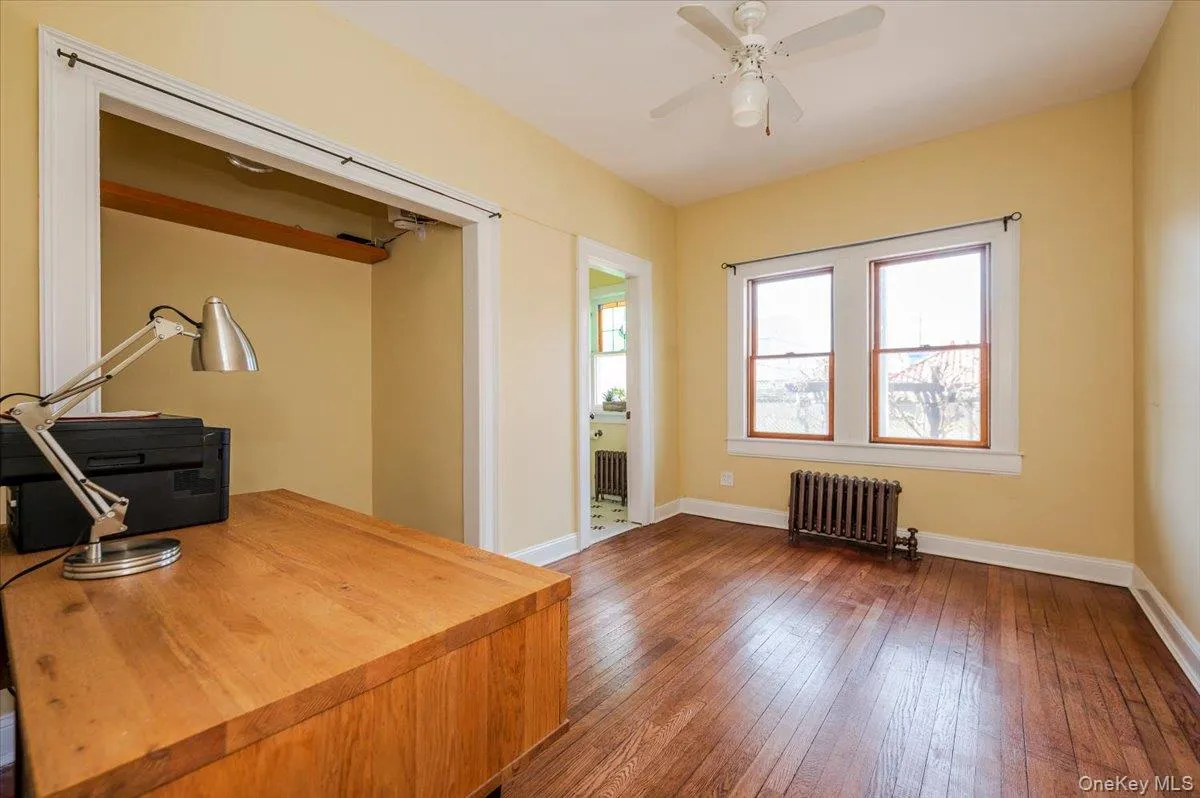 Main floor Office/Bedroom w wood flooring and ceiling fan Main floor Office/Bedroom w wood flooring and ceiling fan