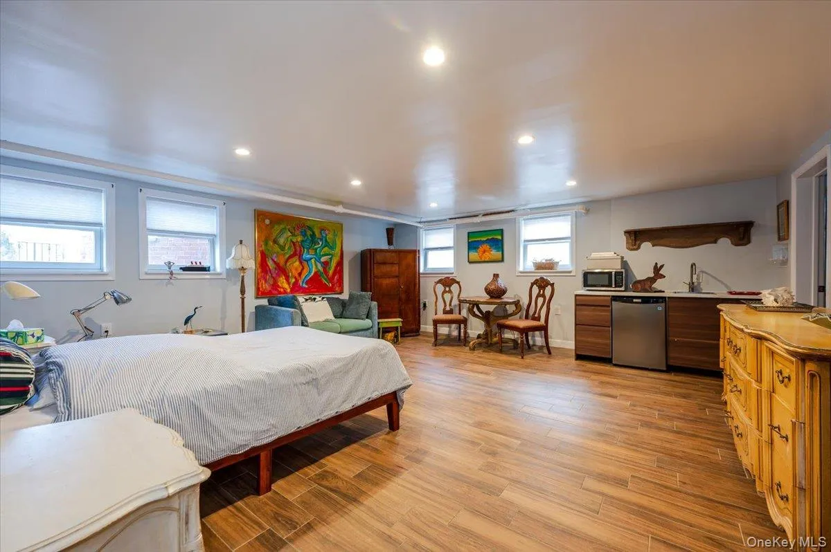 Guest quarters/In-Law Suite/Bedroom with light wood-type flooring, a sink, and recessed lighting Guest quarters/In-Law Suite/Bedroom with light wood-type flooring, a sink, and recessed lighting