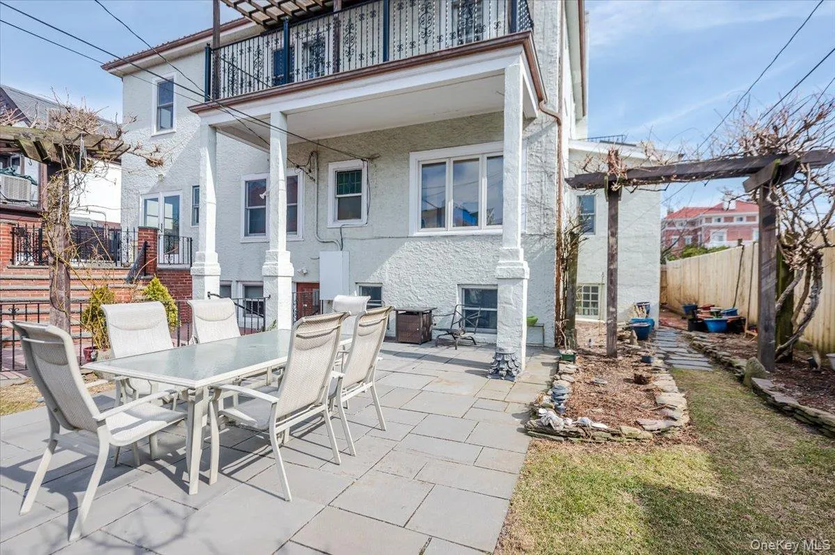 View of Rear patio/terrace with access to gardens, Garden level/basement, upper kitchen patio. Fully fenced with outdoor dining space View of Rear patio/terrace with access to gardens, Garden level/basement, upper kitchen patio. Fully fenced with outdoor dining space