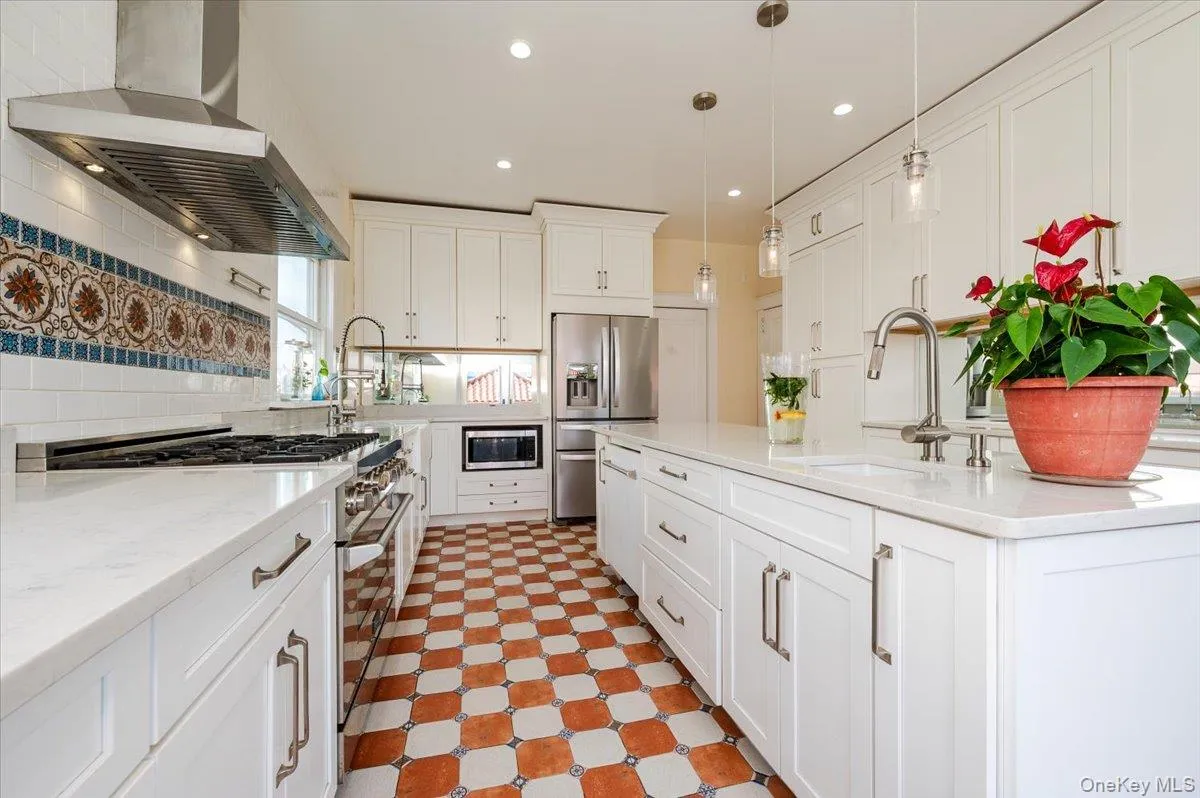 Large, bright Kitchen featuring stainless steel pro line appliances with stainless steel finishes, tile floors Large, bright Kitchen featuring stainless steel pro line appliances with stainless steel finishes, tile floors