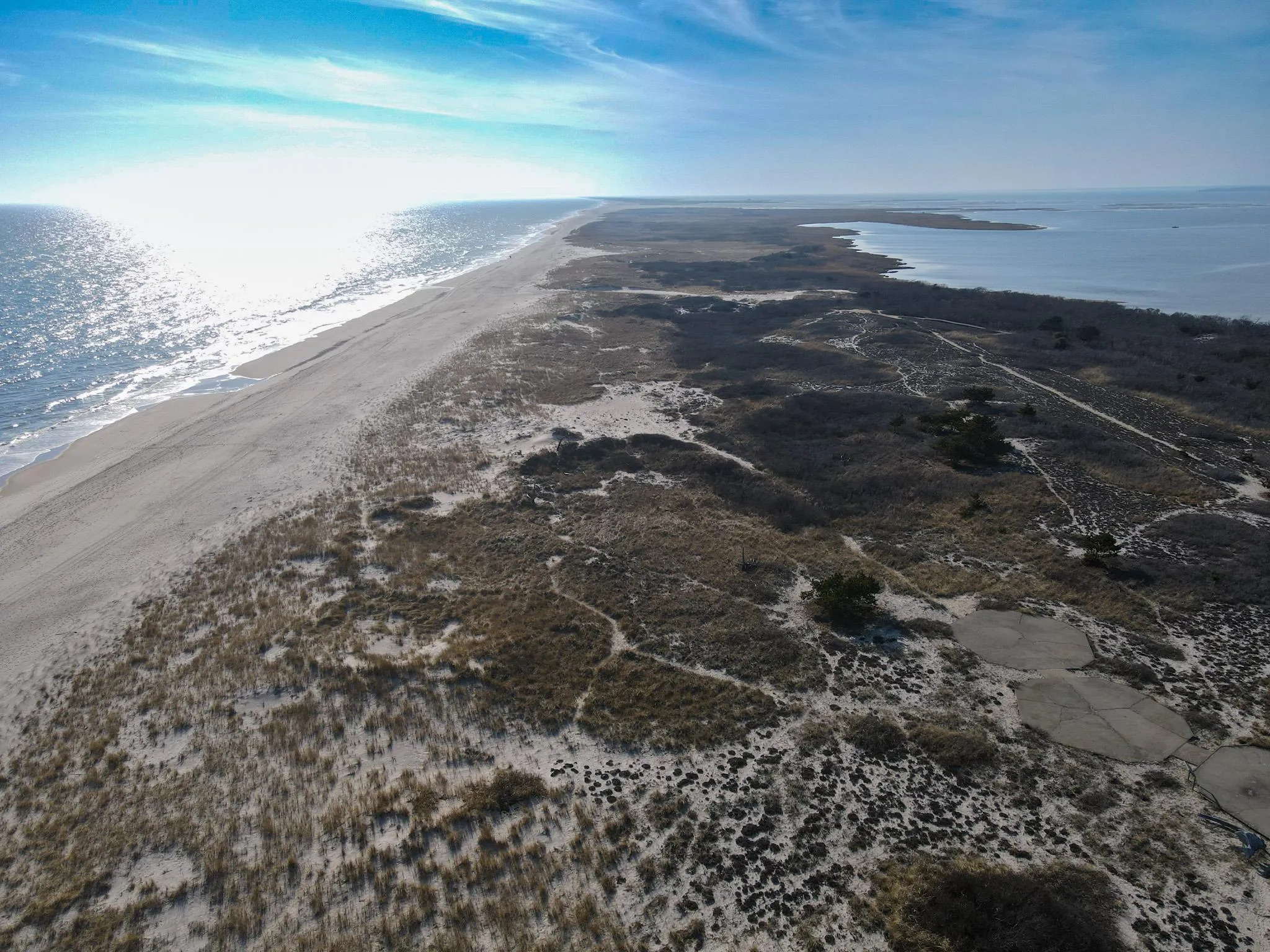 Birds eye view of property featuring a beach view and a water view Birds eye view of property featuring a beach view and a water view
