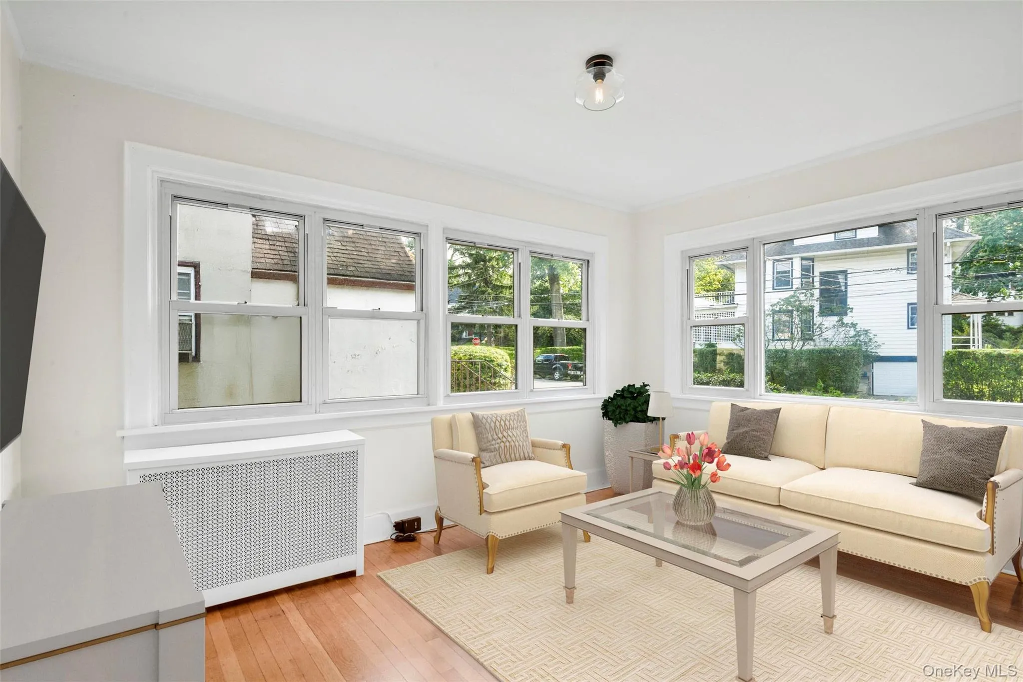 Sunroom / solarium with radiator heating unit and healthy amount of natural light Sunroom / solarium with radiator heating unit and healthy amount of natural light