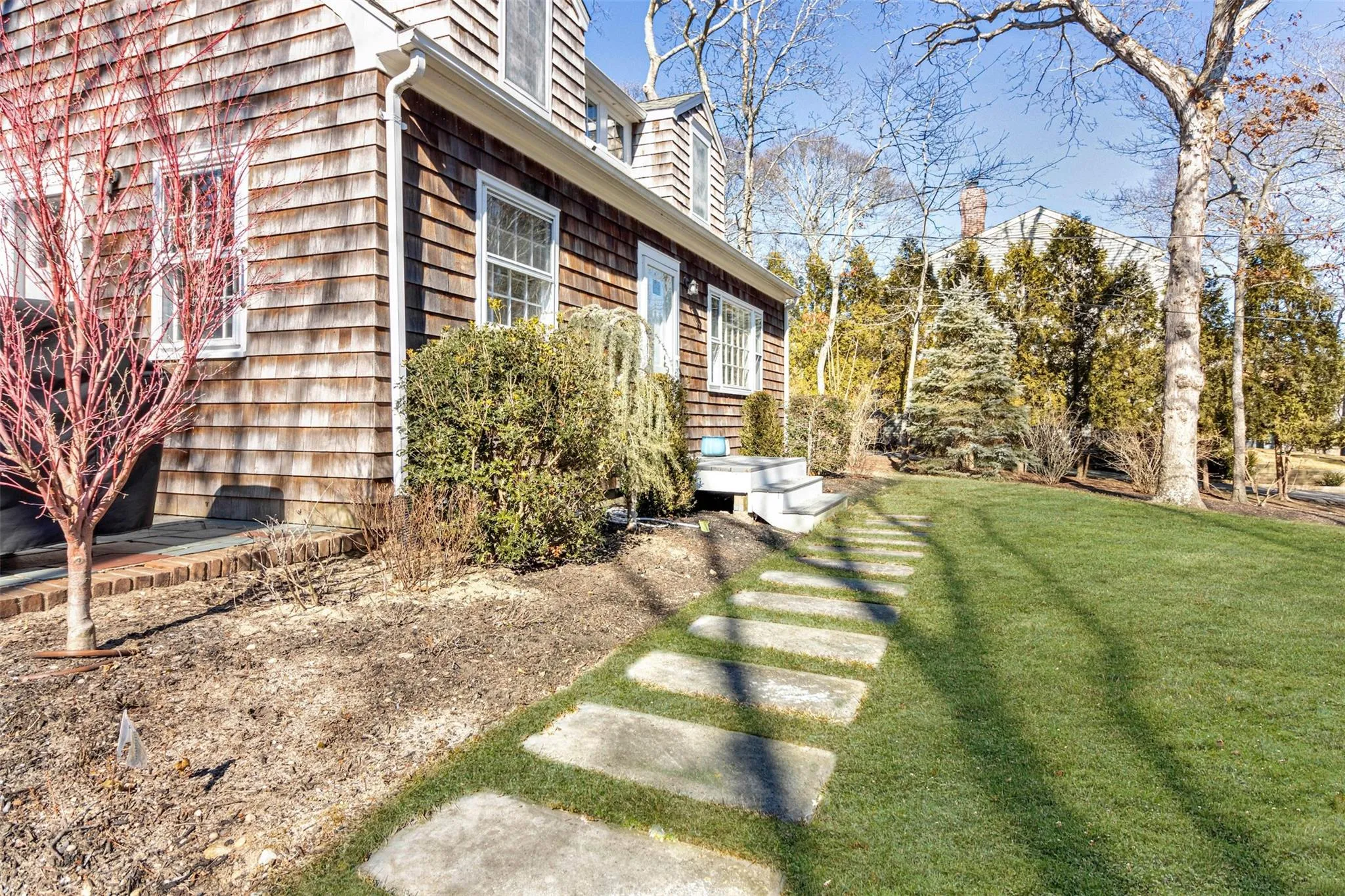 View of side of property featuring a yard View of side of property featuring a yard