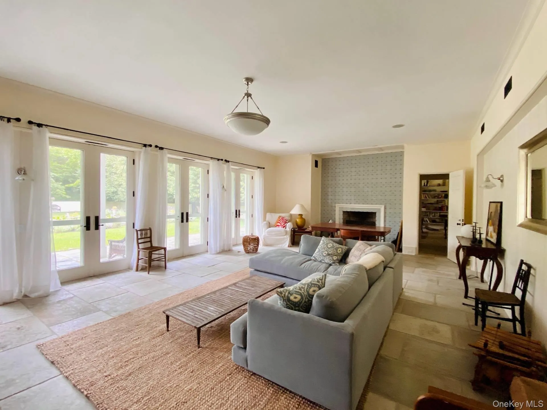 Living area with a fireplace and french doors Living area with a fireplace and french doors