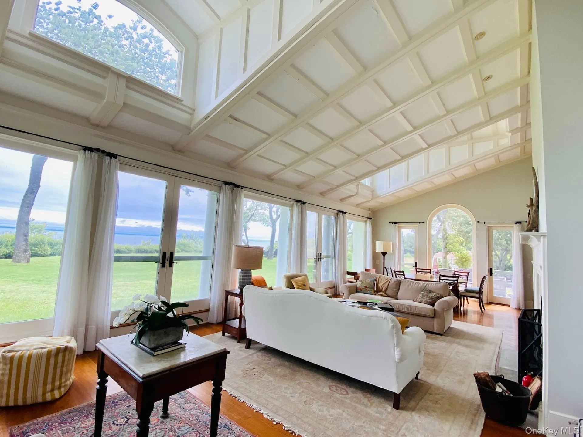 Sunroom featuring french doors and vaulted ceiling Sunroom featuring french doors and vaulted ceiling