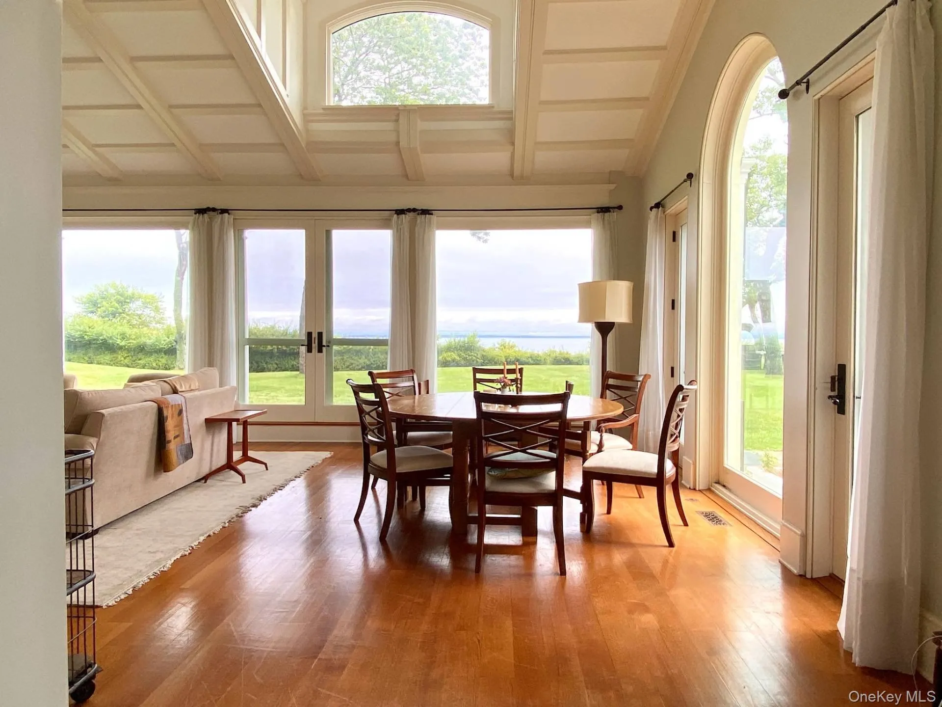 Sunroom featuring french doors, visible vents, and beamed ceiling Sunroom featuring french doors, visible vents, and beamed ceiling