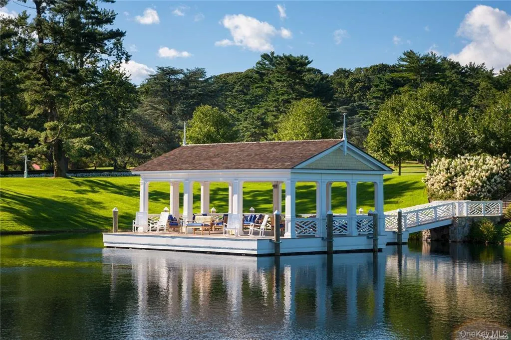 Dock featuring a water view and a yard Dock featuring a water view and a yard