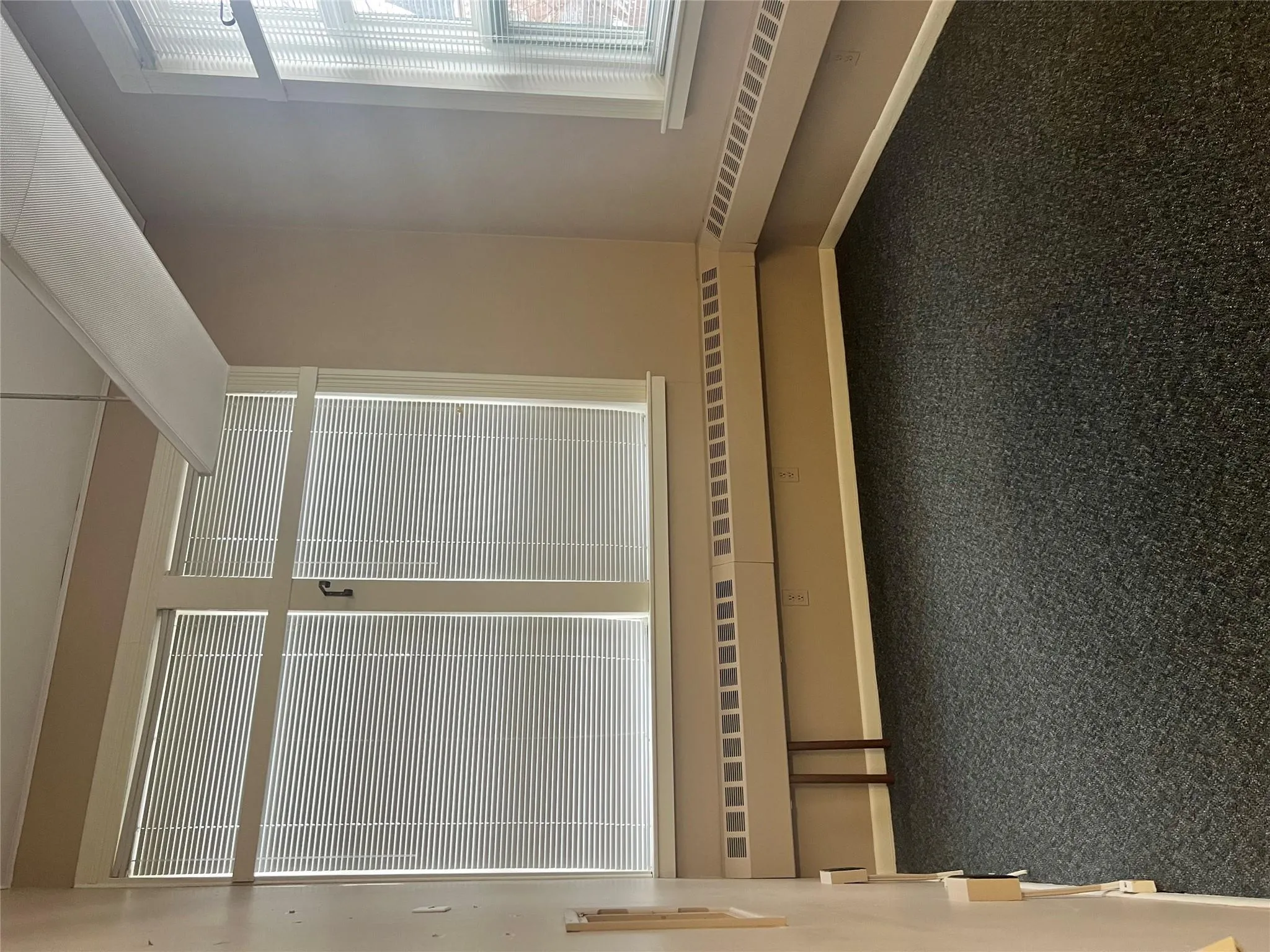 Unfurnished room with carpet and baseboards Unfurnished room with carpet and baseboards