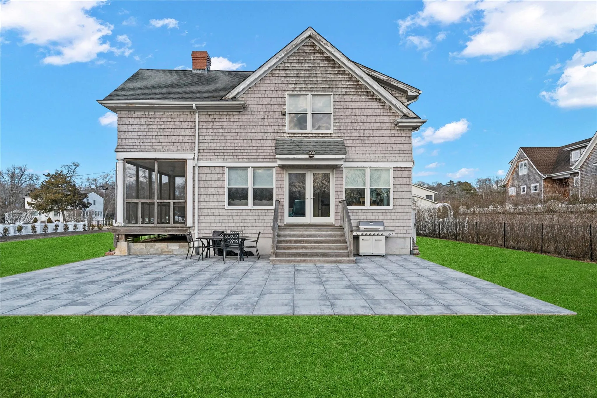 Rear view of house with a yard, a chimney, fence, and a patio Rear view of house with a yard, a chimney, fence, and a patio