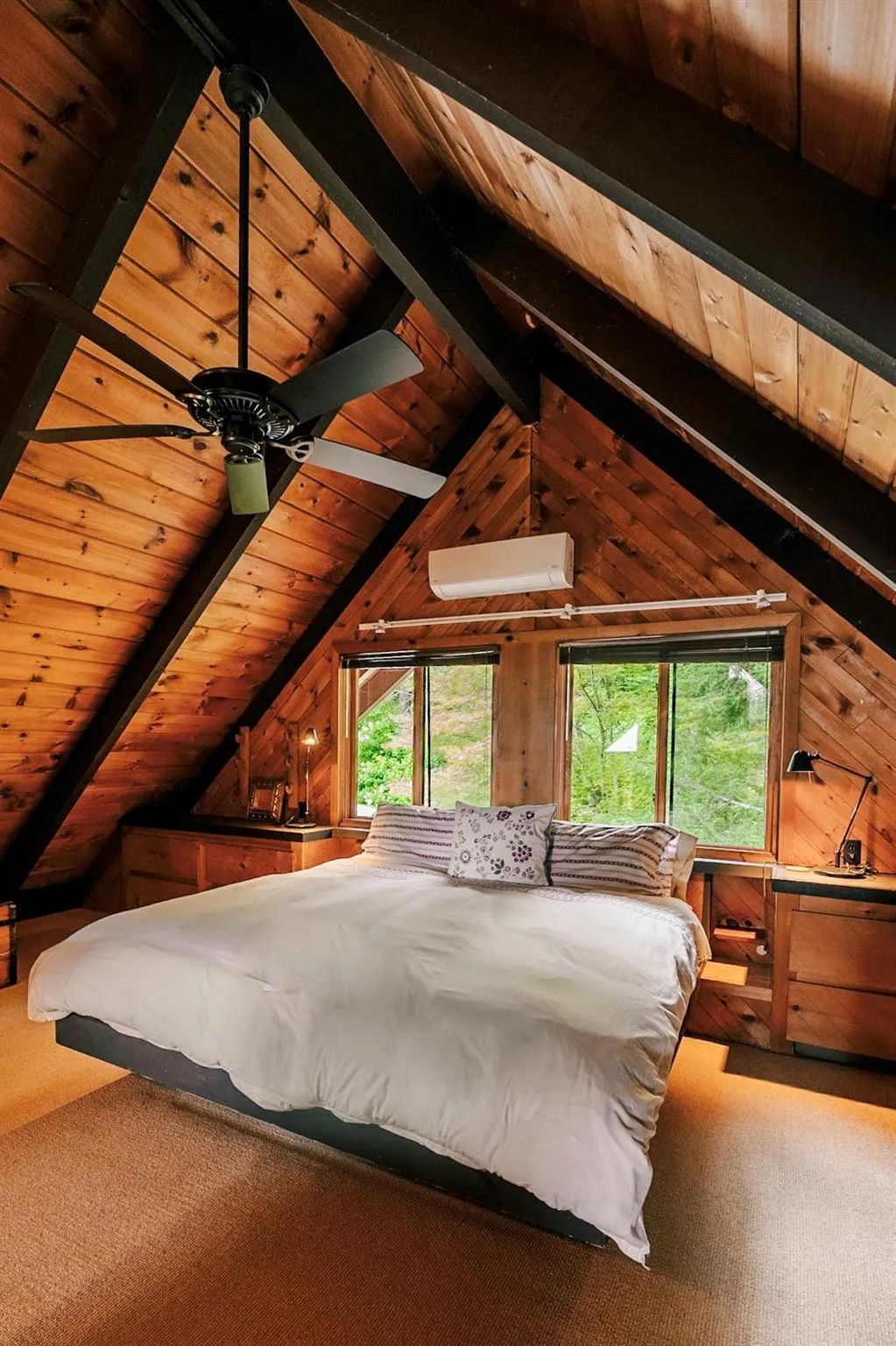 Primary bedroom and lofted ceiling with beams Primary bedroom and lofted ceiling with beams