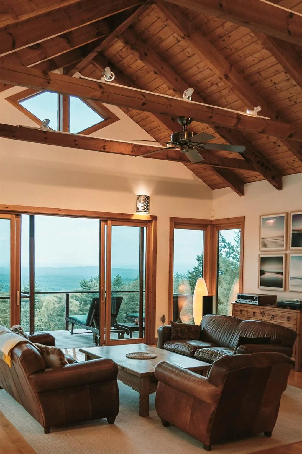 Living area with vaulted ceiling with beams, wooden ceiling, and a water view Living area with vaulted ceiling with beams, wooden ceiling, and a water view