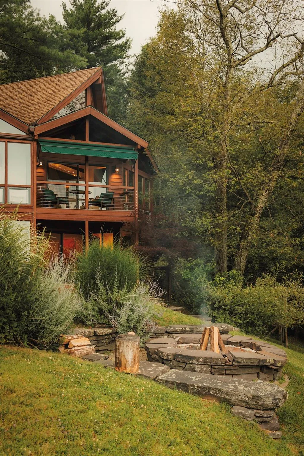 View of yard featuring an outdoor fire pit View of yard featuring an outdoor fire pit