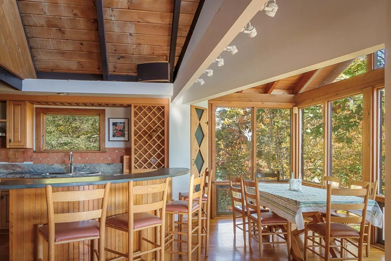 Bar featuring wooden ceiling, indoor wet bar, wood finished floors, vaulted ceiling with beams, and a sink Bar featuring wooden ceiling, indoor wet bar, wood finished floors, vaulted ceiling with beams, and a sink