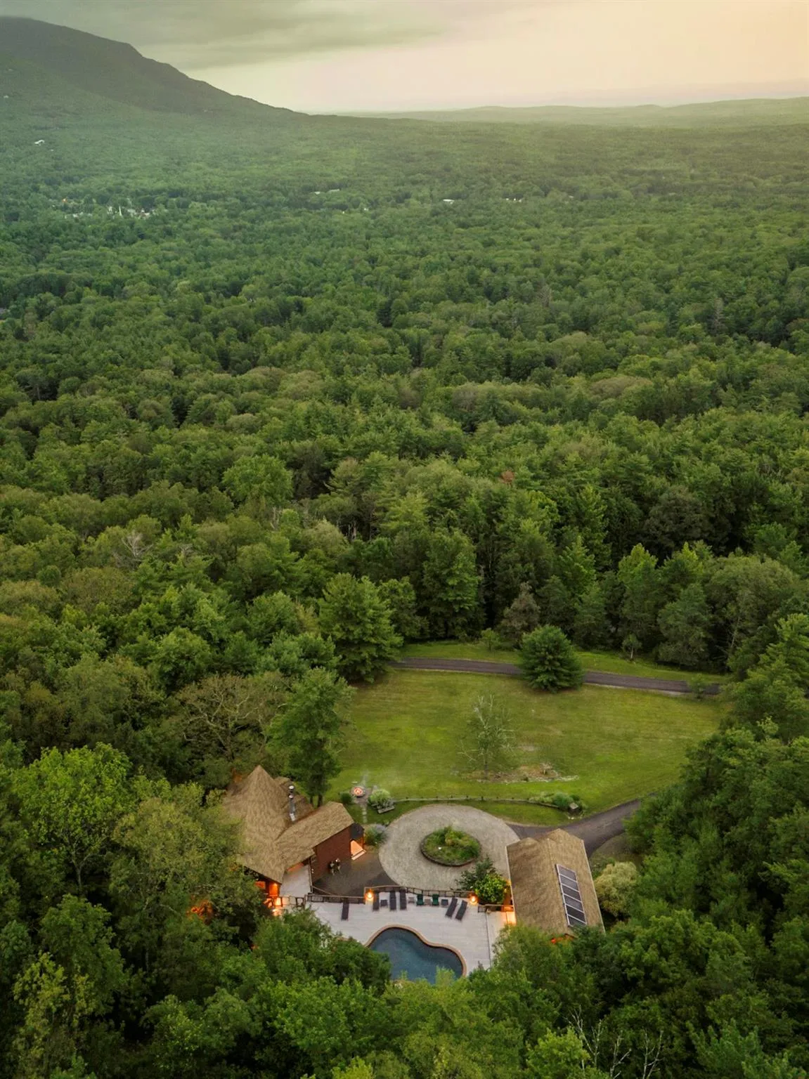 Drone / aerial view with a forest view and a mountain view Drone / aerial view with a forest view and a mountain view