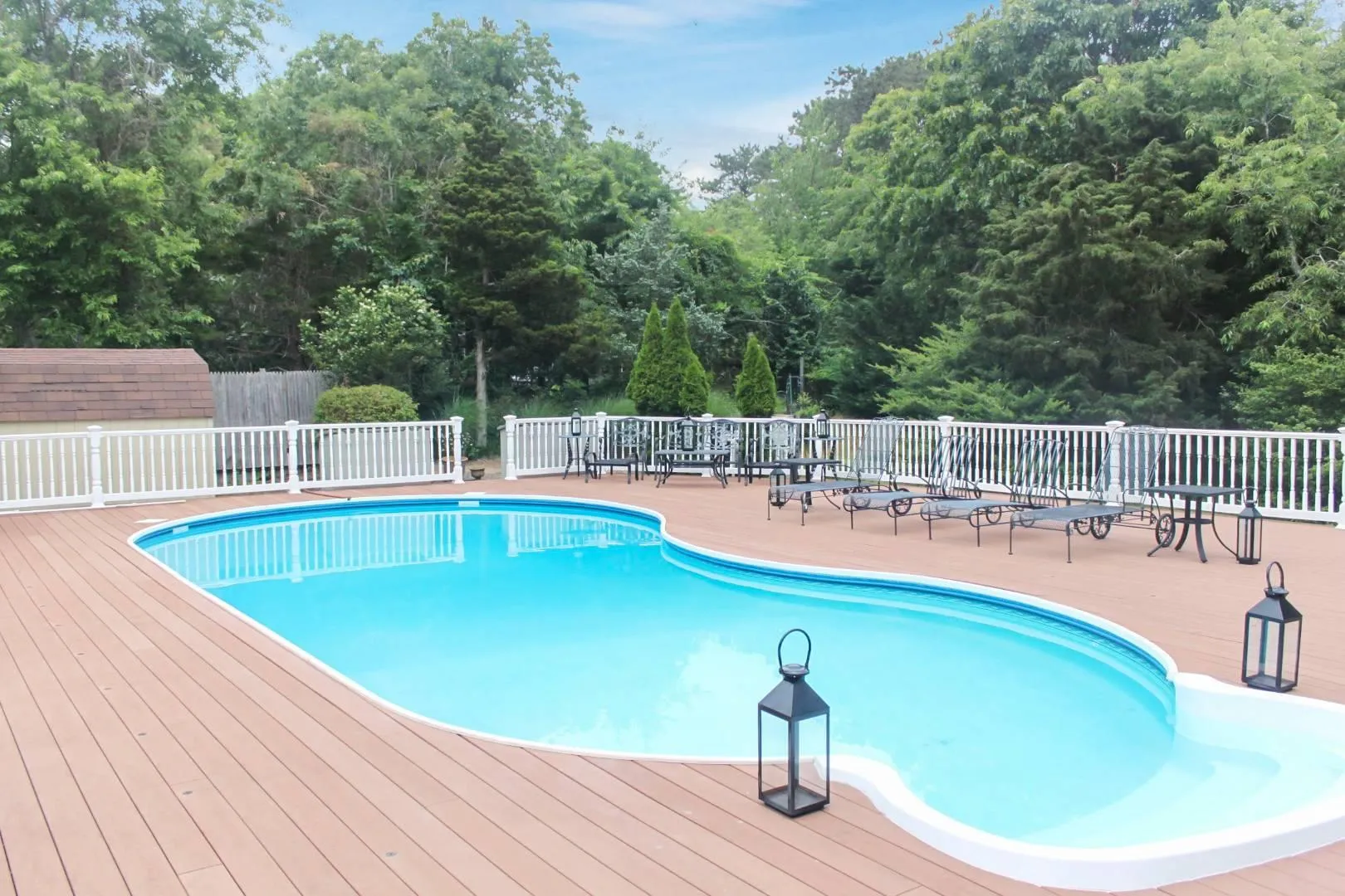 Heated Pool and Pool deck Close up fenced in pool, fence, and a deck Heated Pool and Pool deck Close up fenced in pool, fence, and a deck
