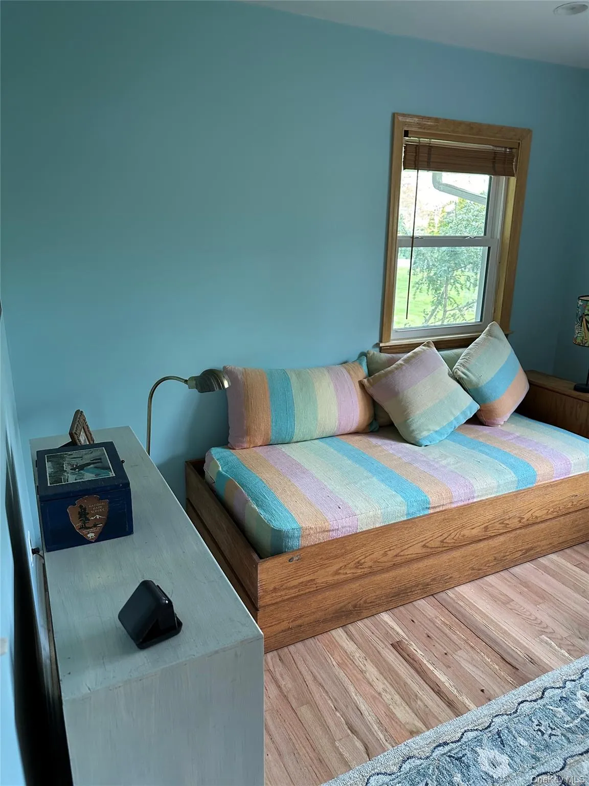 Bedroom featuring wood finished floors Bedroom featuring wood finished floors