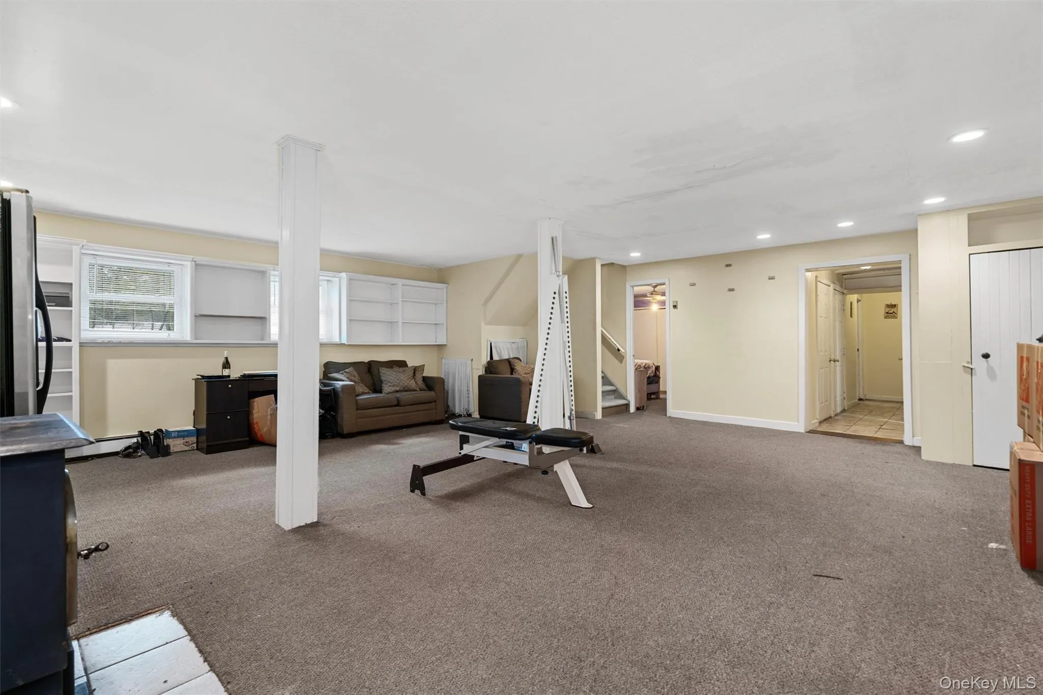 Exercise area featuring recessed lighting, baseboards, and carpet Exercise area featuring recessed lighting, baseboards, and carpet