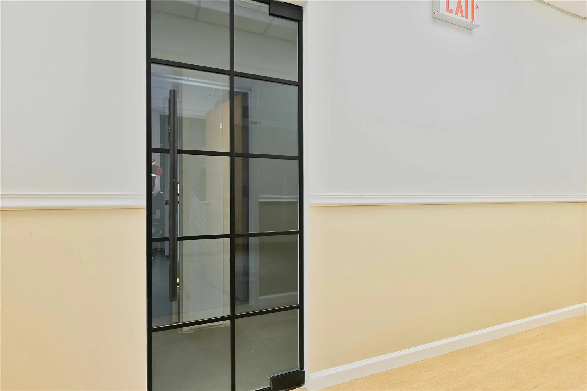 Room details featuring baseboards and wood finished floors Room details featuring baseboards and wood finished floors