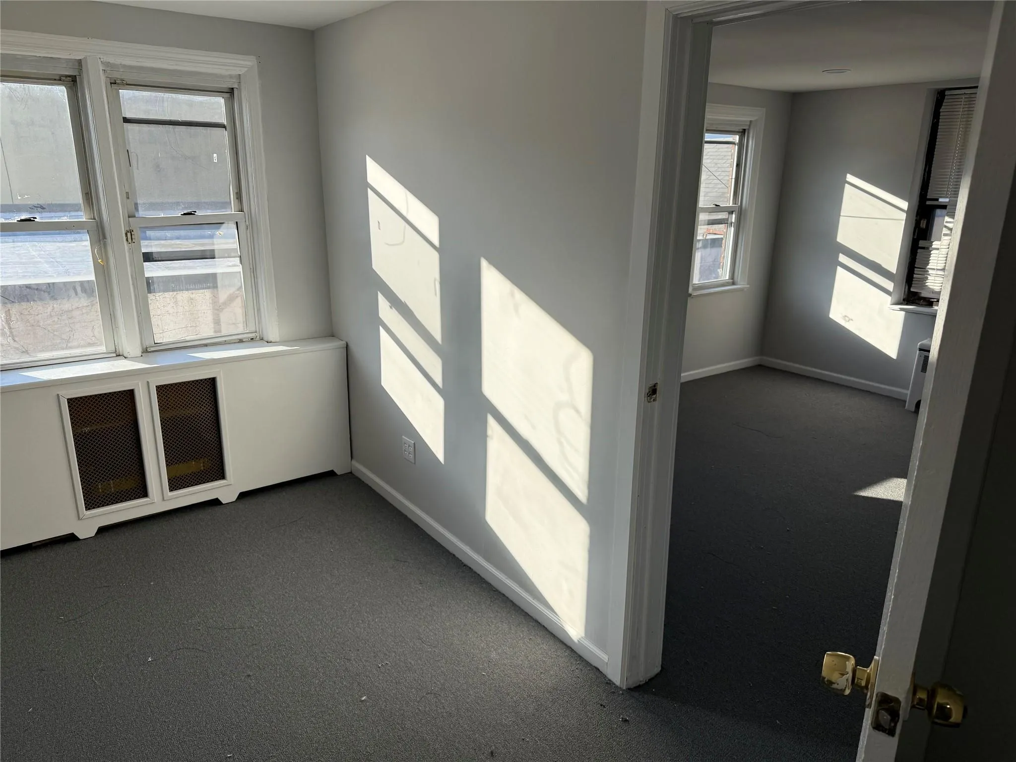 Unfurnished room featuring carpet and baseboards Unfurnished room featuring carpet and baseboards