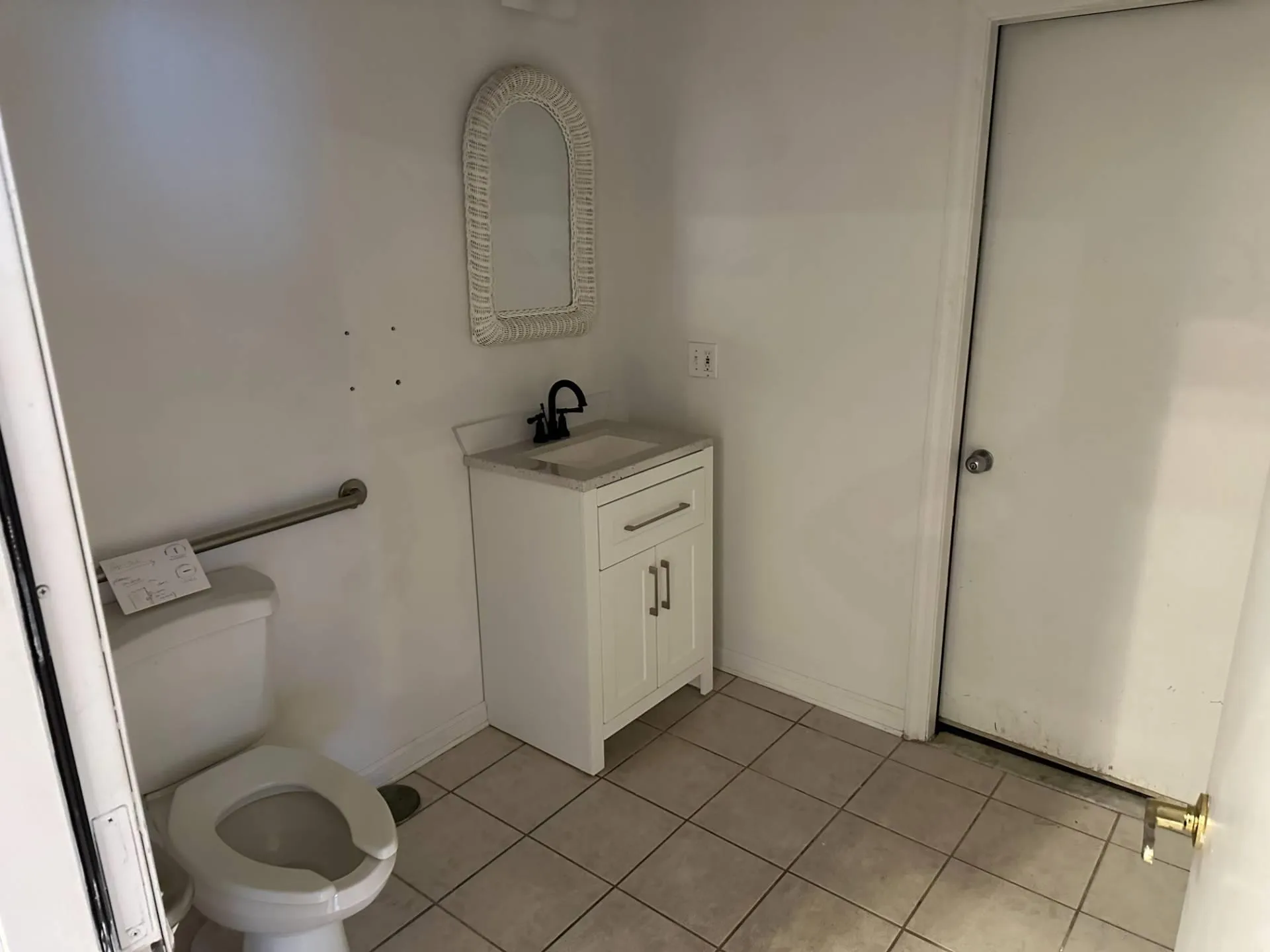 Half bathroom with toilet, tile patterned flooring, baseboards, and vanity Half bathroom with toilet, tile patterned flooring, baseboards, and vanity