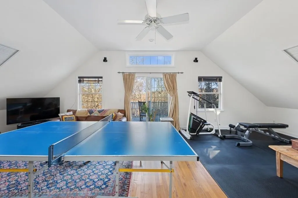 Game room with lofted ceiling and ceiling fan Game room with lofted ceiling and ceiling fan