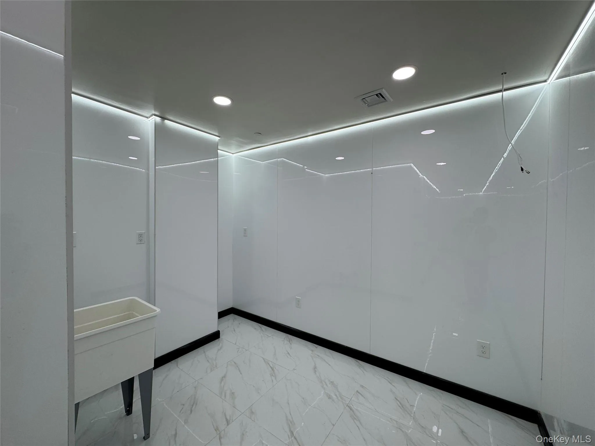 Unfurnished room featuring marble finish floor, visible vents, and recessed lighting Unfurnished room featuring marble finish floor, visible vents, and recessed lighting
