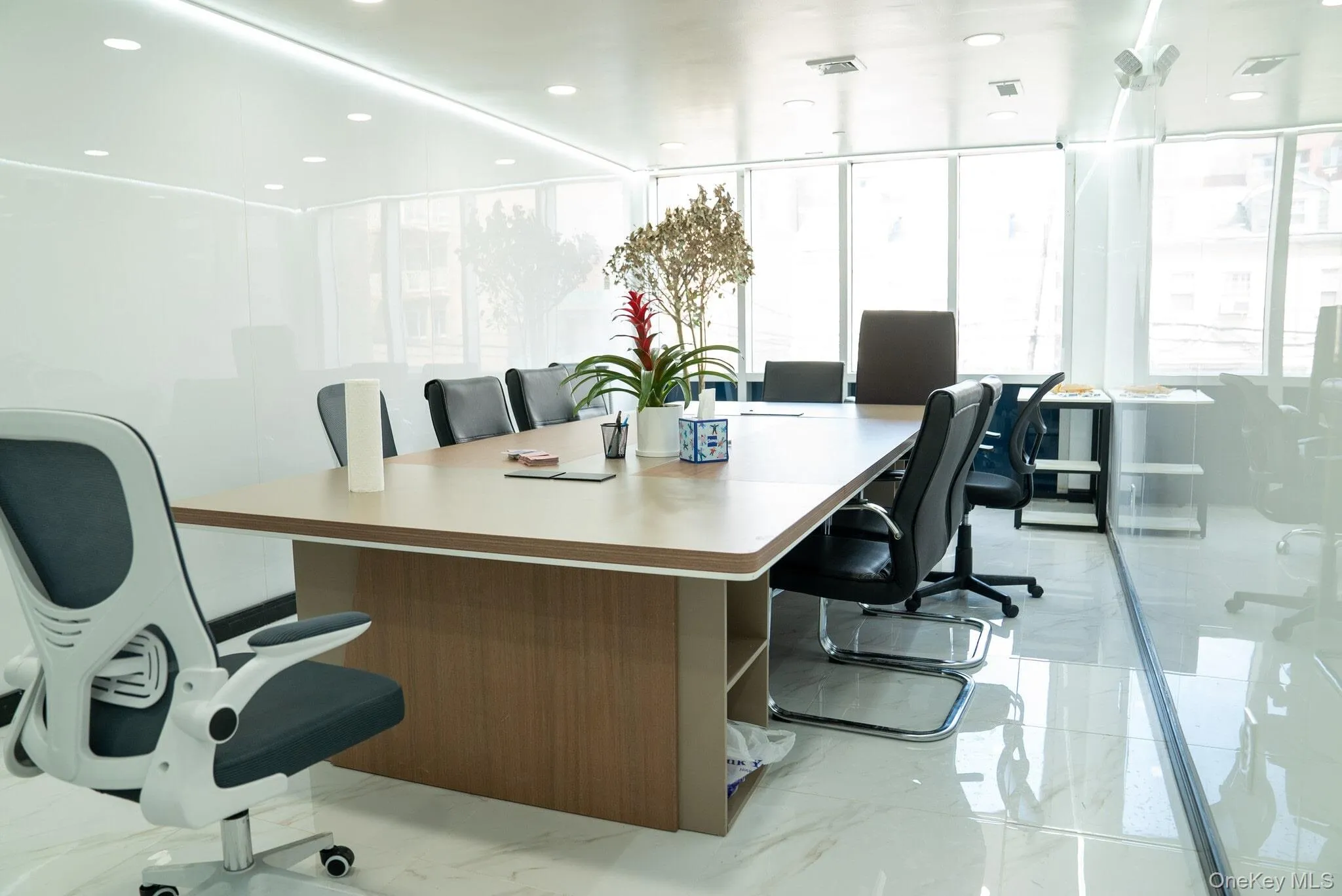 Office space featuring marble finish floor and visible vents Office space featuring marble finish floor and visible vents